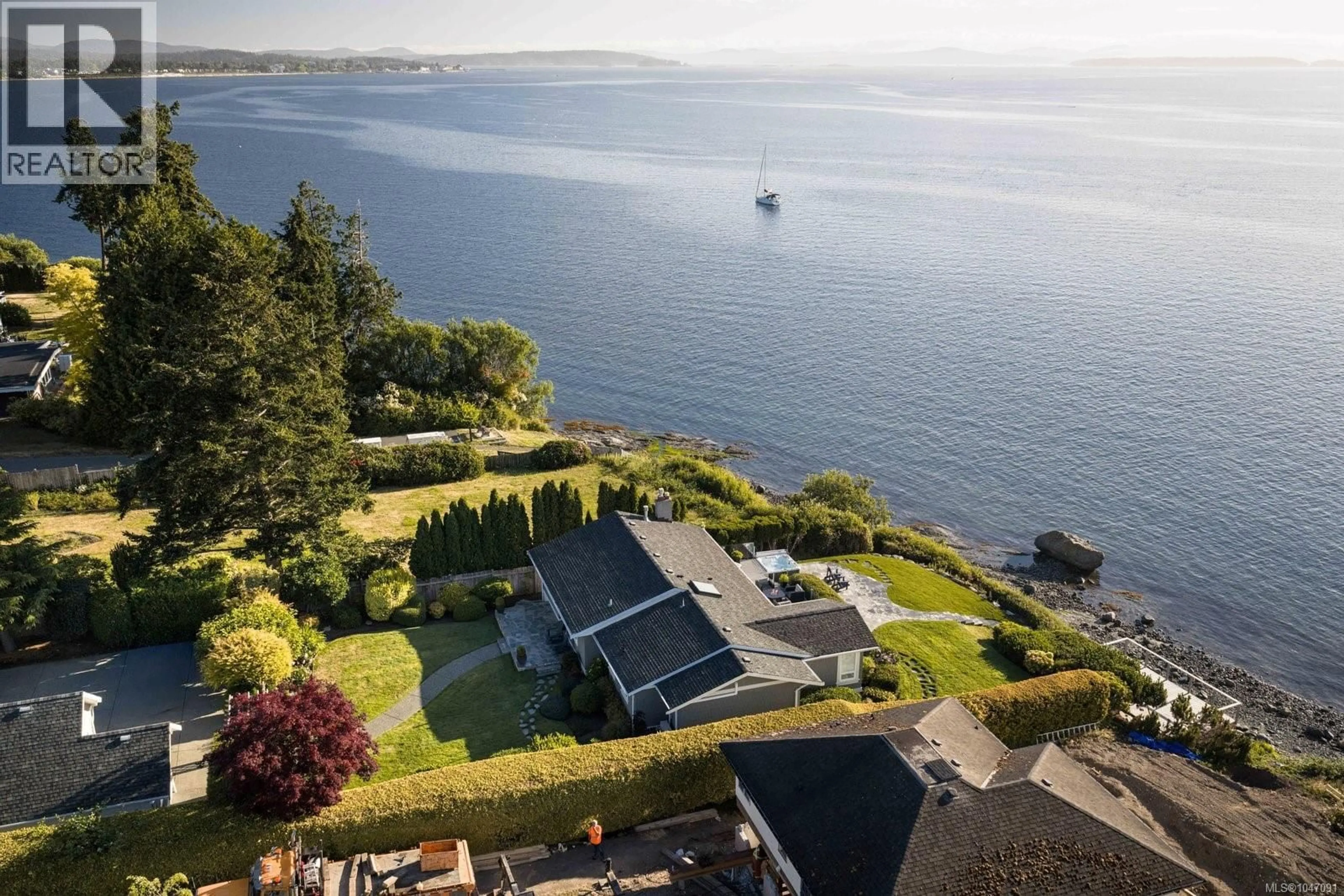 A pic from outside/outdoor area/front of a property/back of a property/a pic from drone, water/lake/river/ocean view for 8585 LOCHSIDE DRIVE, North Saanich British Columbia V8L1M5