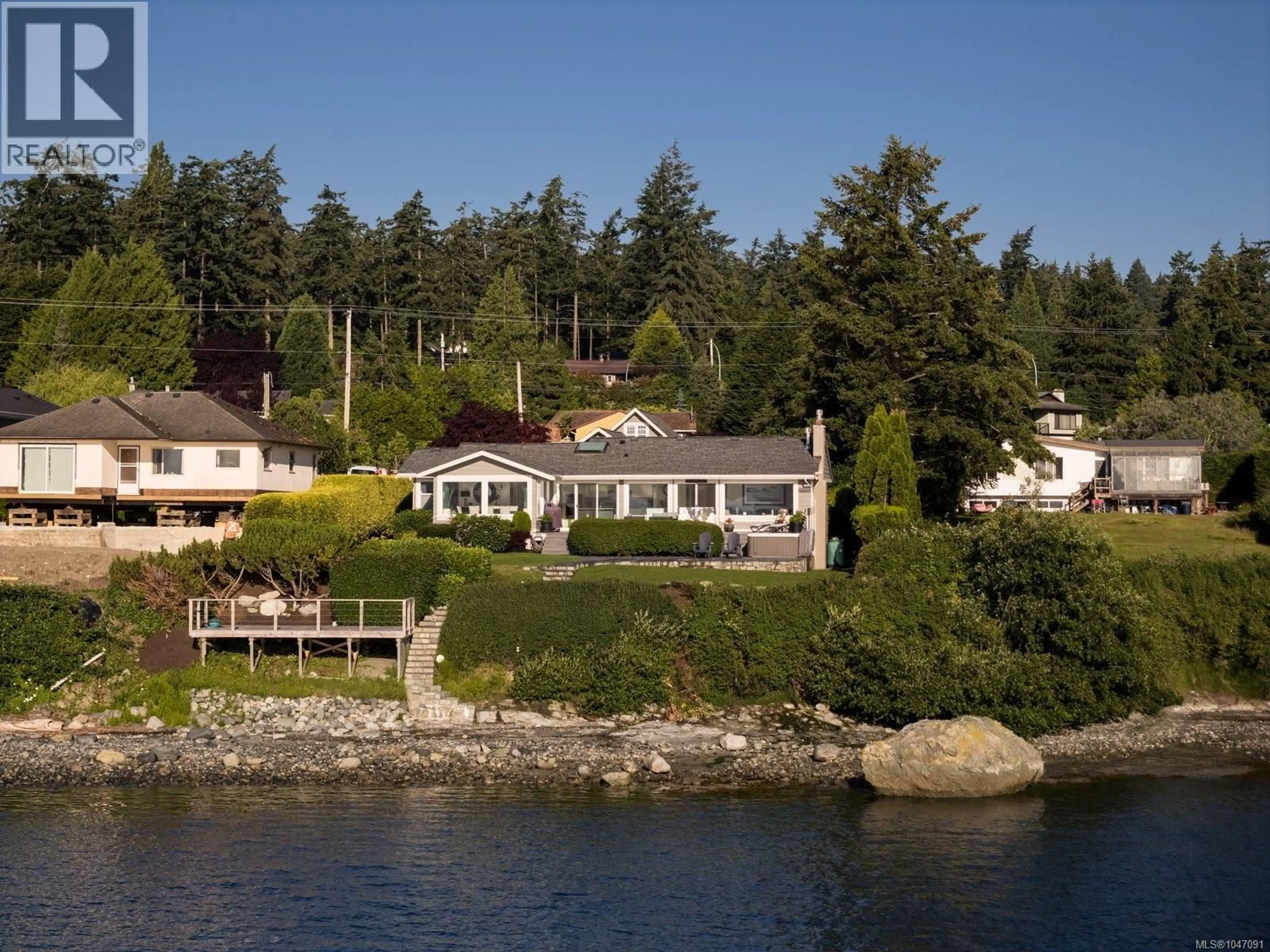 A pic from outside/outdoor area/front of a property/back of a property/a pic from drone, water/lake/river/ocean view for 8585 LOCHSIDE DRIVE, North Saanich British Columbia V8L1M5