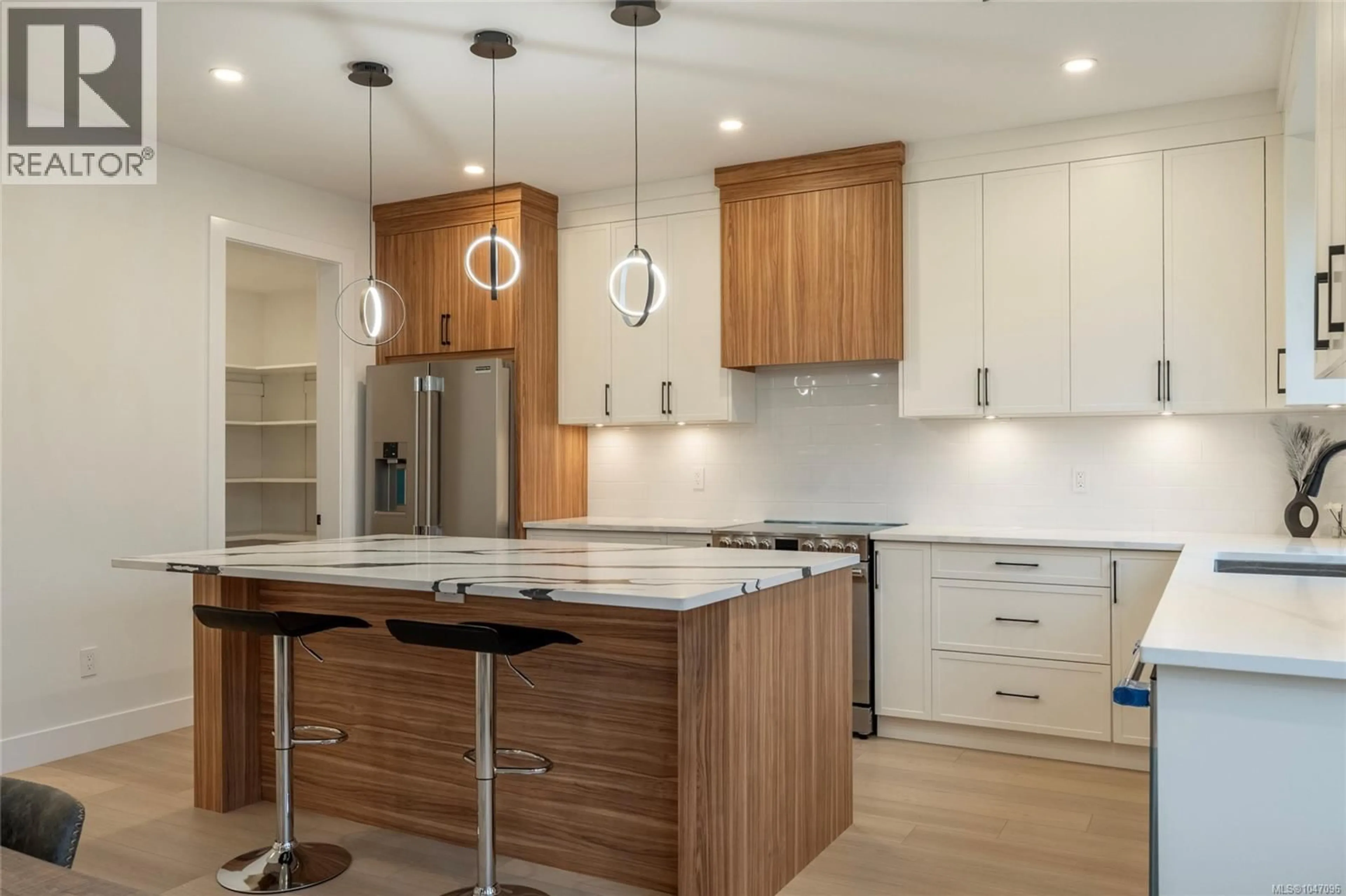 Open concept kitchen, wood/laminate floor for 2346 SWALLOW PLACE, Langford British Columbia V9B6Y6