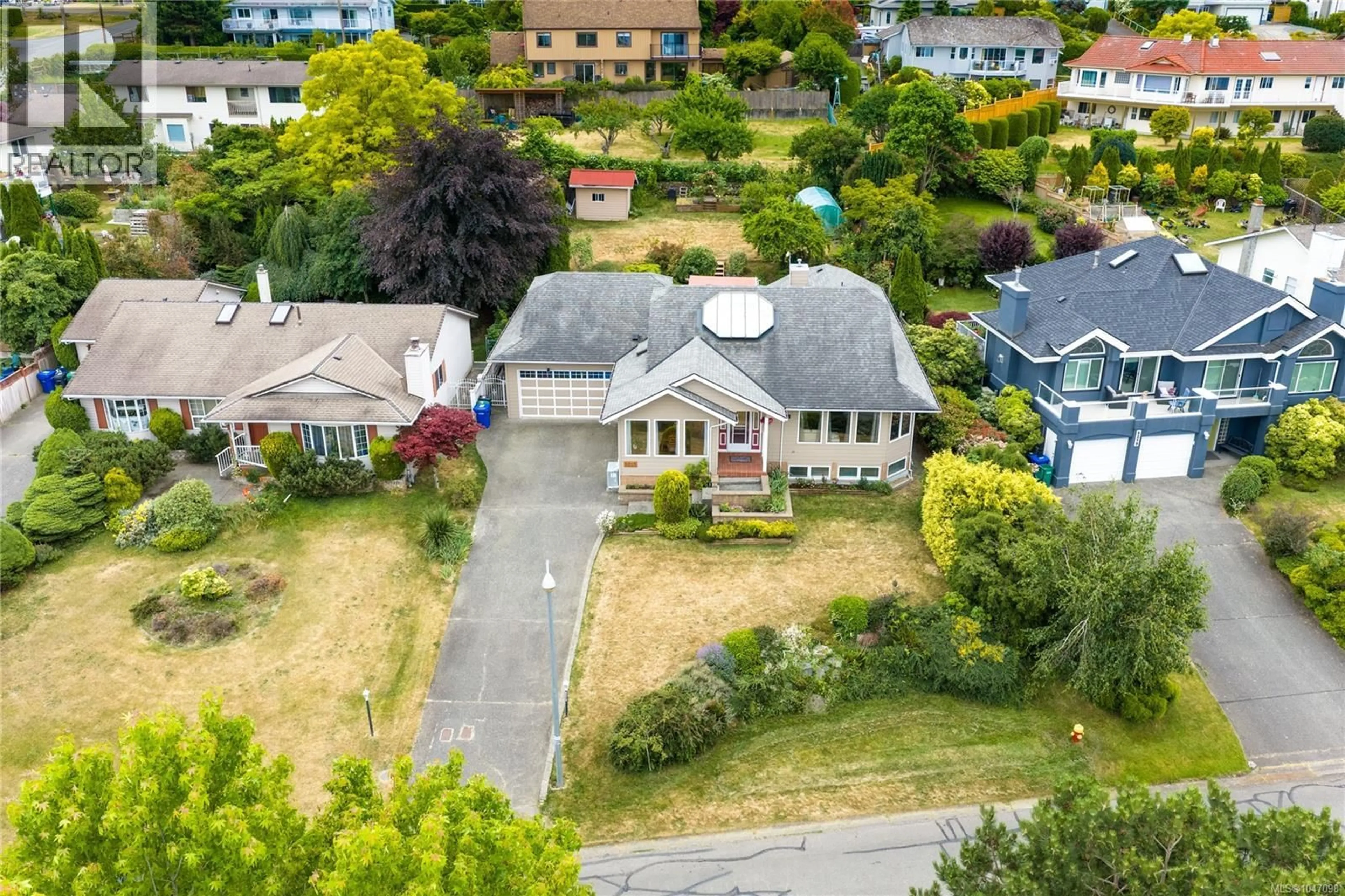 A pic from outside/outdoor area/front of a property/back of a property/a pic from drone, street for 5213 FILLINGER CRESCENT, Nanaimo British Columbia V9V1H7