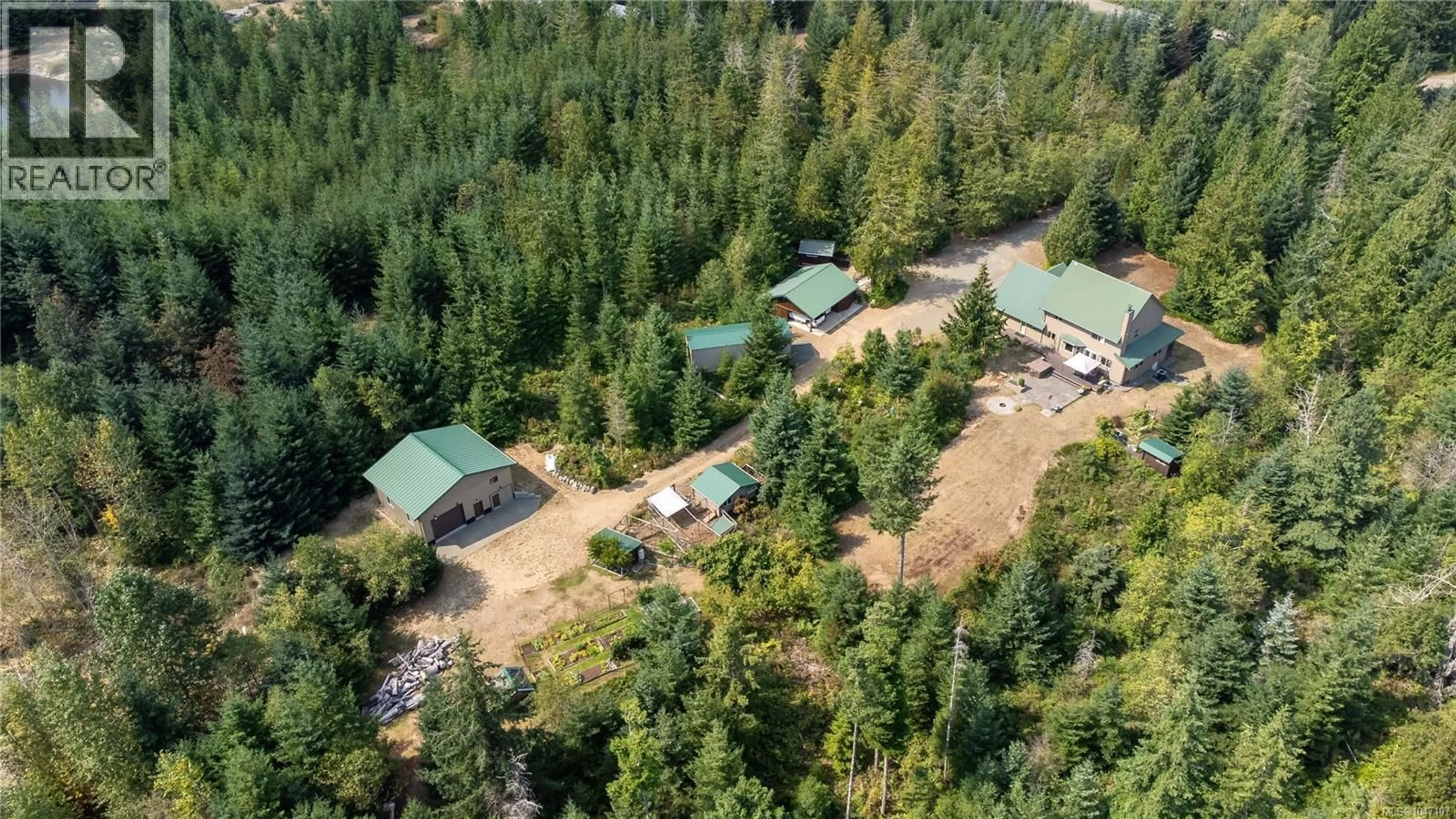 A pic from outside/outdoor area/front of a property/back of a property/a pic from drone, forest/trees view for 1131 HECKER ROAD, Merville British Columbia V0R2M0