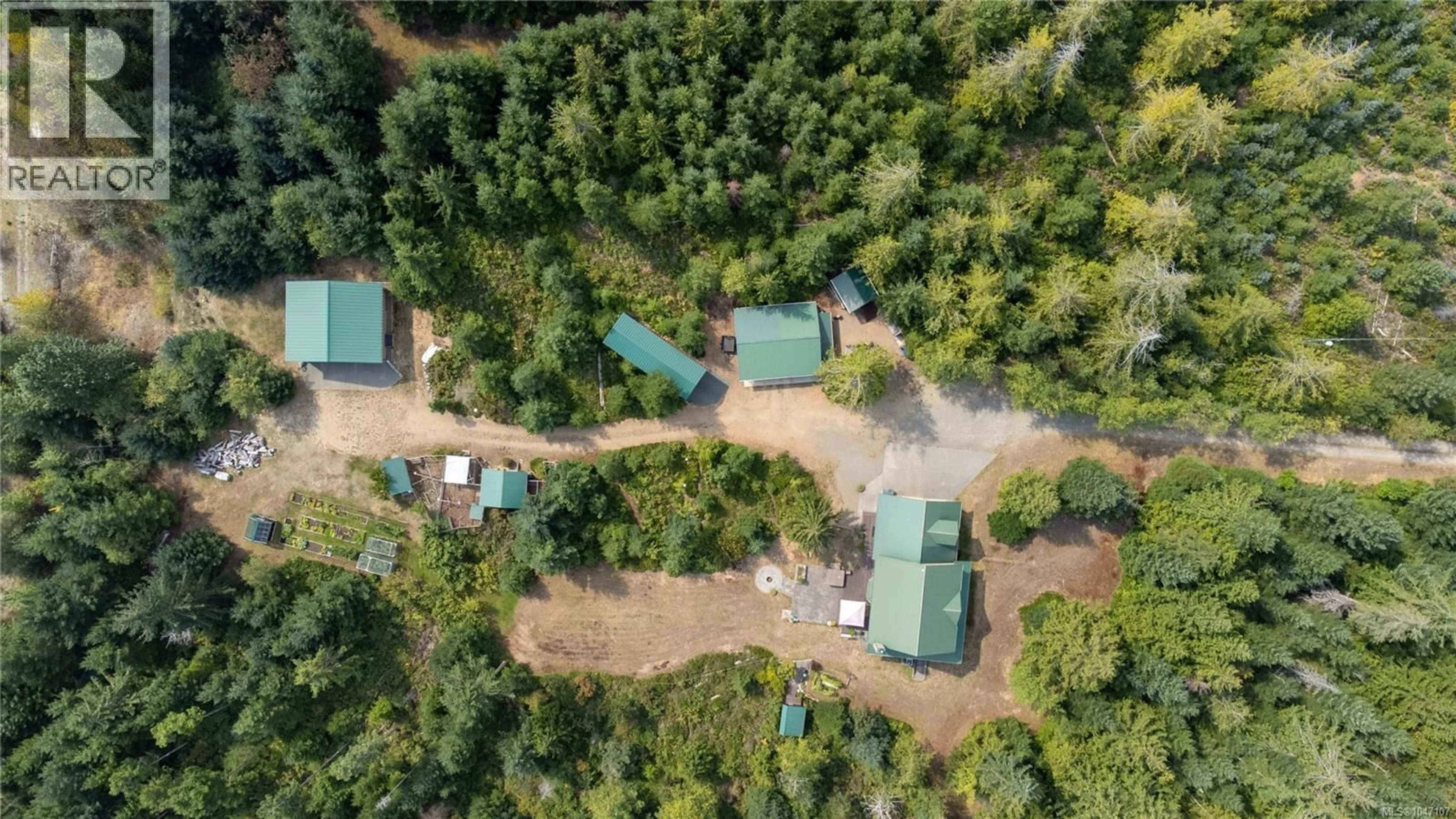 A pic from outside/outdoor area/front of a property/back of a property/a pic from drone, forest/trees view for 1131 HECKER ROAD, Merville British Columbia V0R2M0