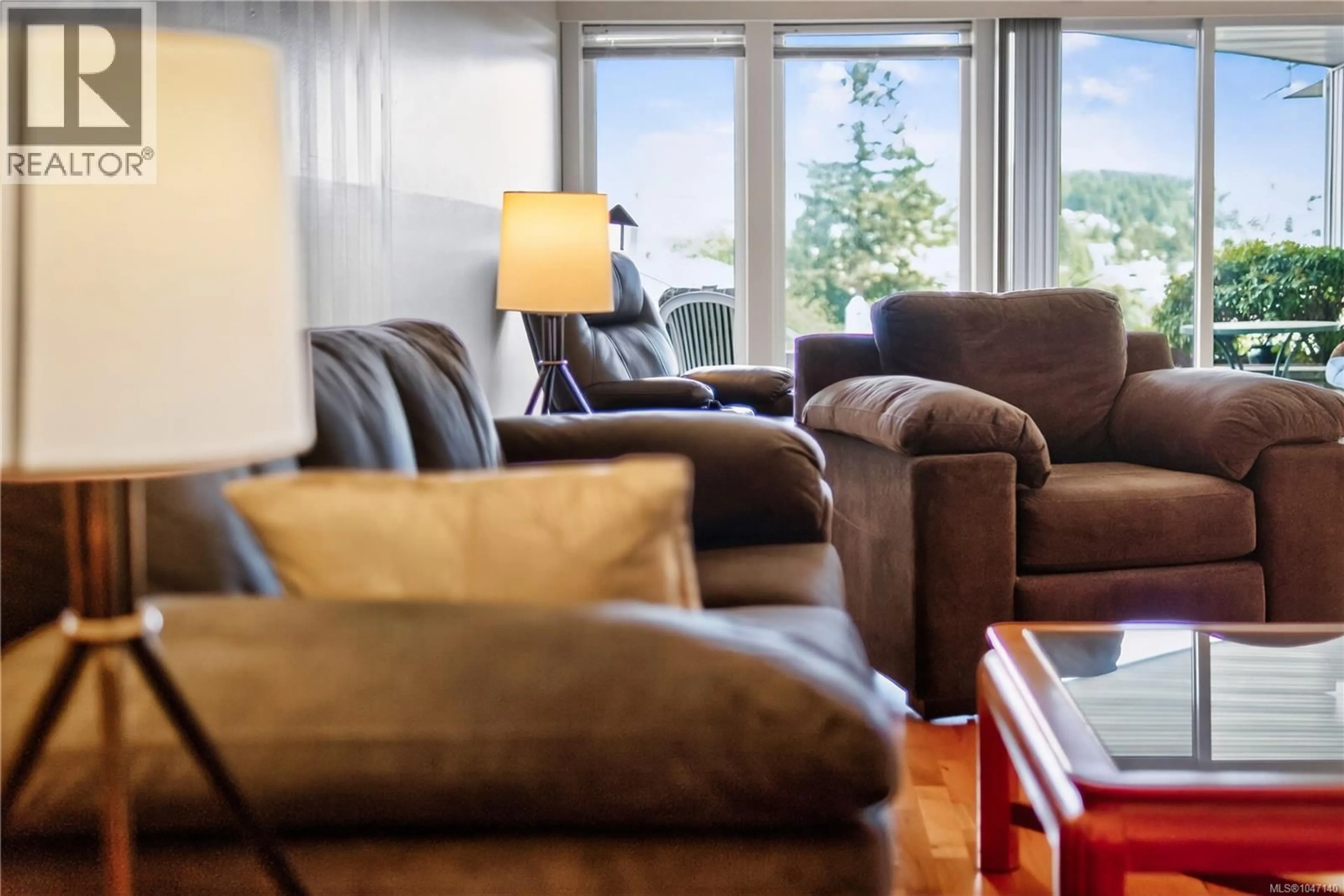 Living room with furniture, wood/laminate floor for 310 - 2560 DEPARTURE BAY ROAD, Nanaimo British Columbia V9S5P1