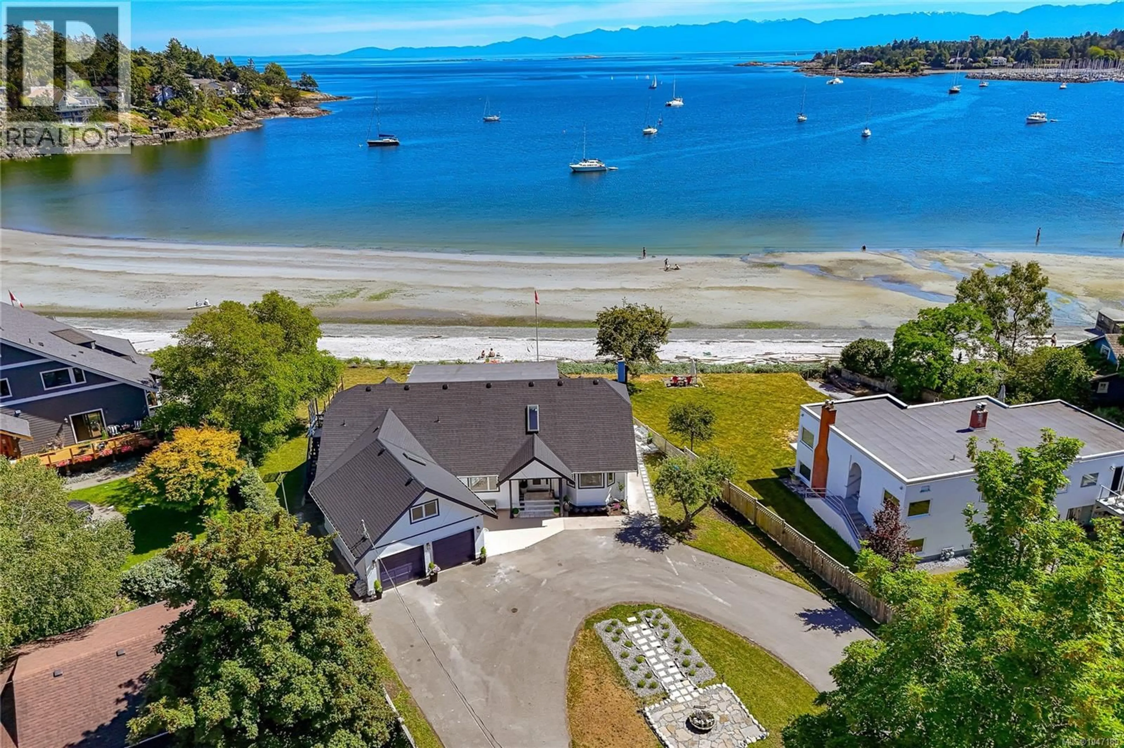 A pic from outside/outdoor area/front of a property/back of a property/a pic from drone, water/lake/river/ocean view for 3905B CADBORO BAY ROAD, Saanich British Columbia V8N4G3