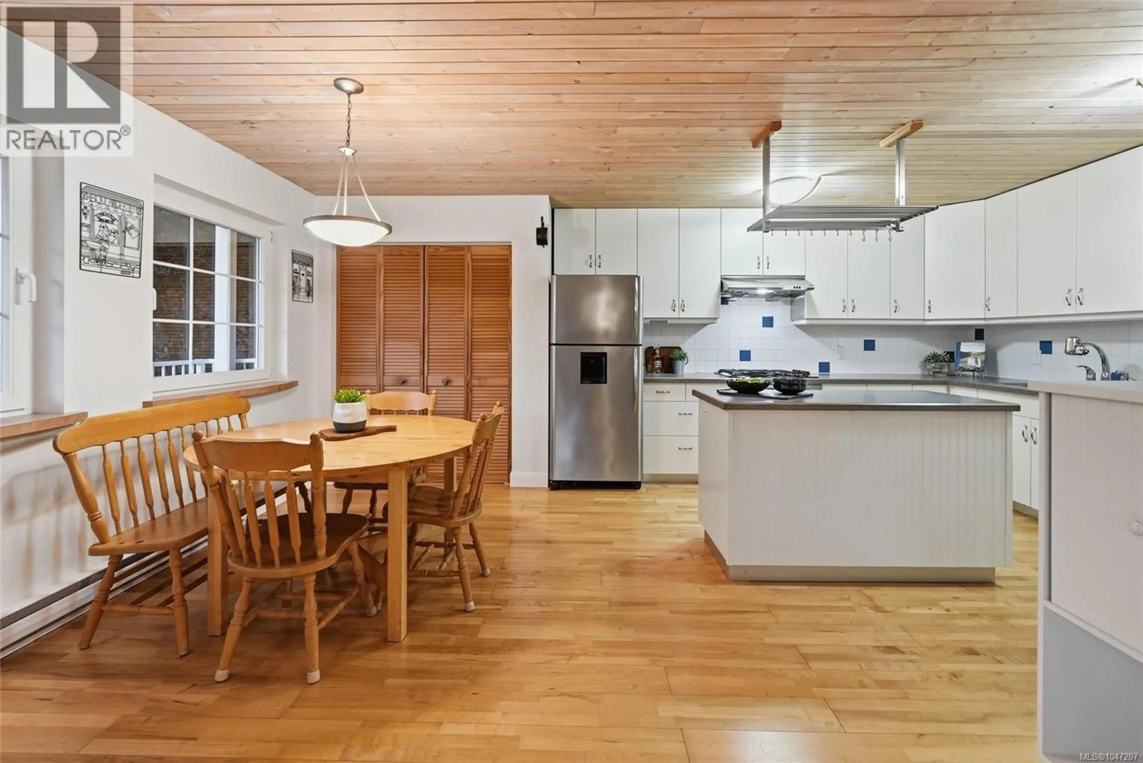 Open concept kitchen, wood/laminate floor for 1973 HARLEQUIN CRESCENT, Nanoose Bay British Columbia V9P9J2