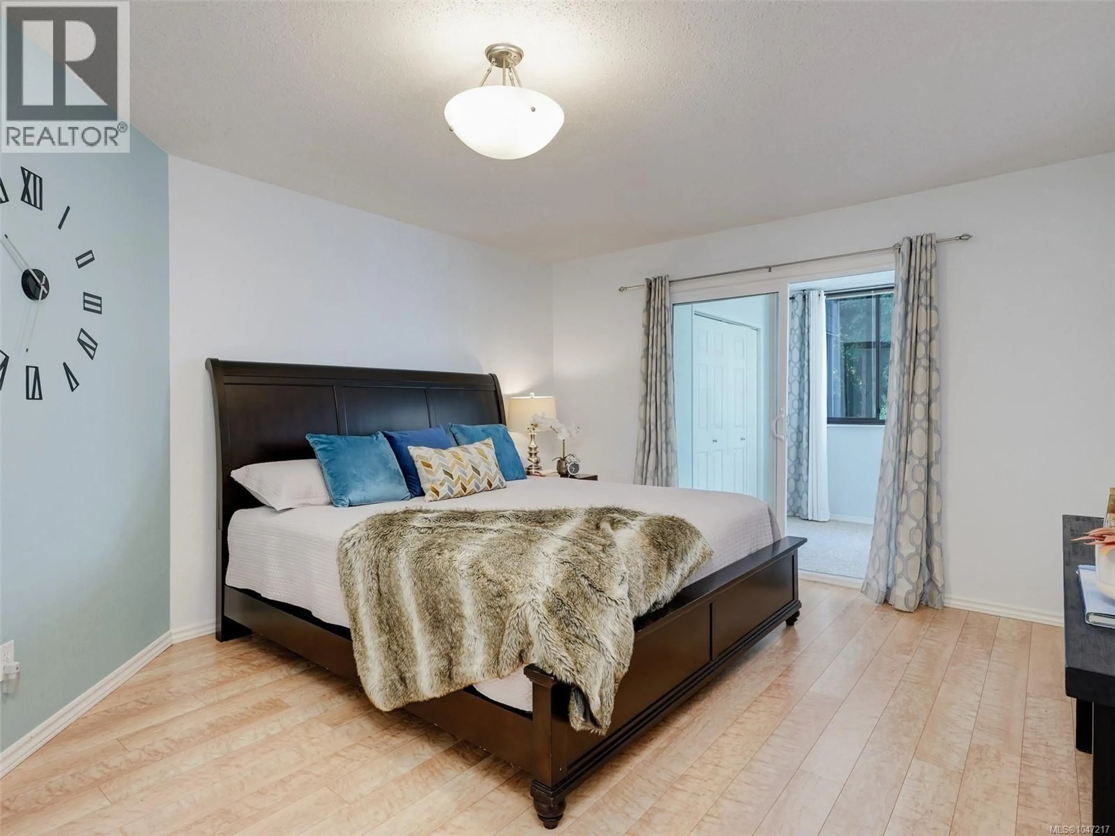 Bedroom with bed, wood/laminate floor for 203 - 1120 FAIRFIELD ROAD, Victoria British Columbia V8V3A7