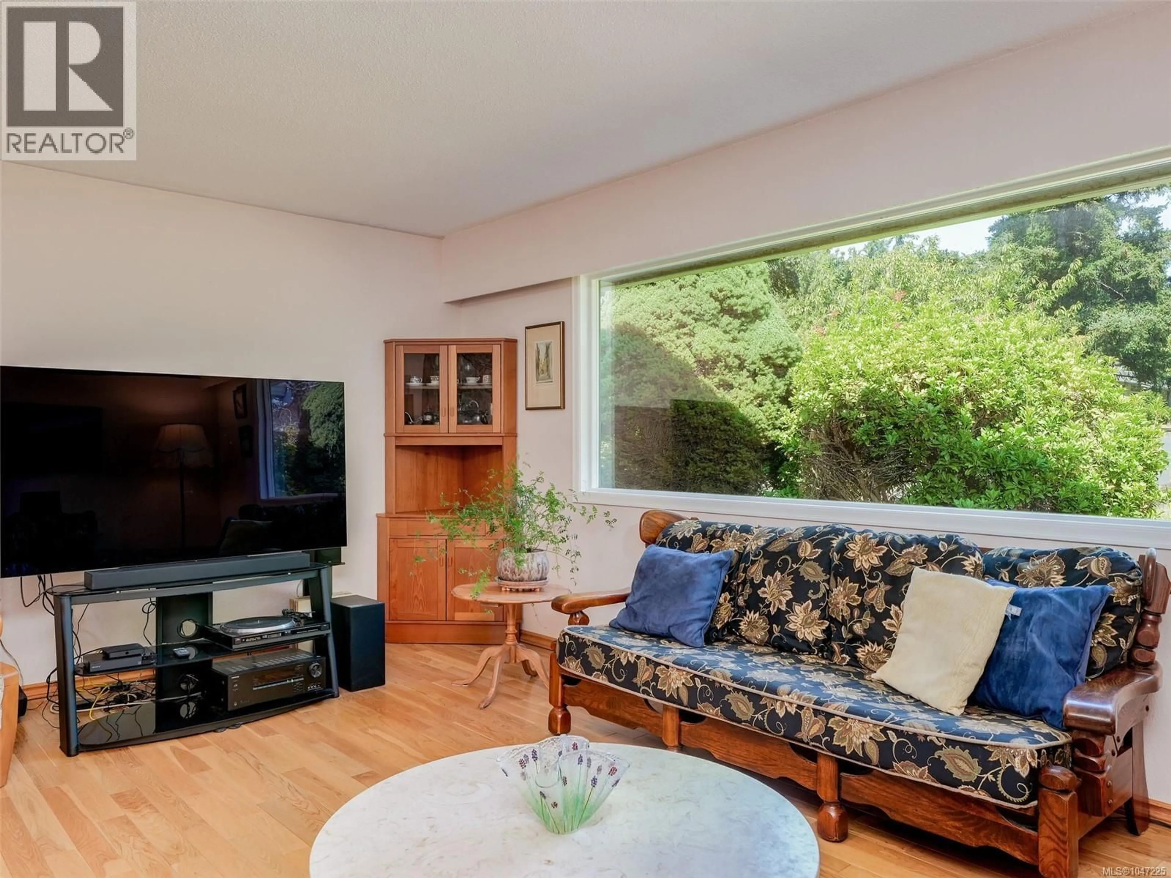 Living room with furniture, wood/laminate floor for 4209 LEERON PLACE, Metchosin British Columbia V9C3Z9