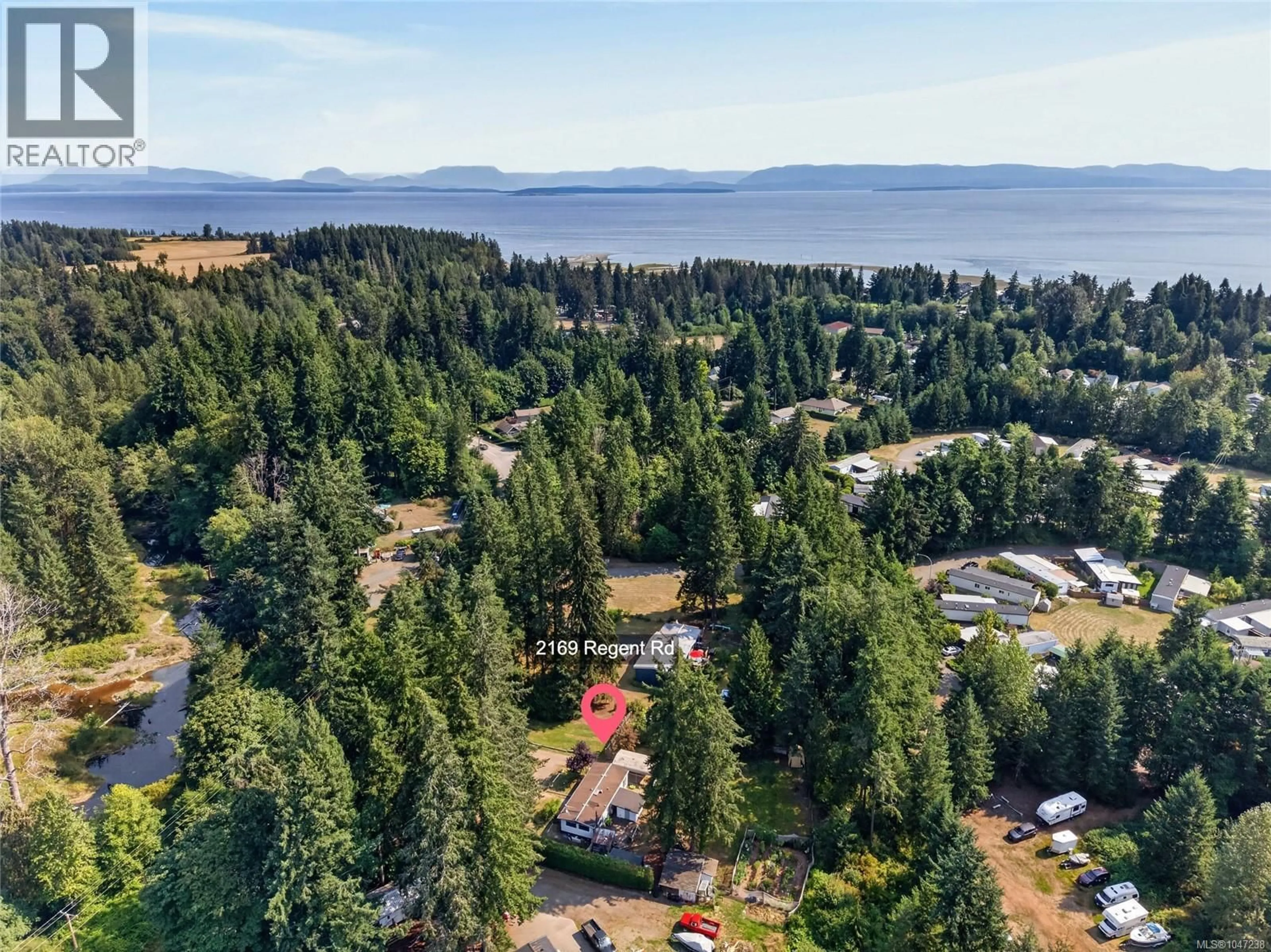 A pic from outside/outdoor area/front of a property/back of a property/a pic from drone, unknown for 2169 REGENT ROAD, Black Creek British Columbia V9J1A1