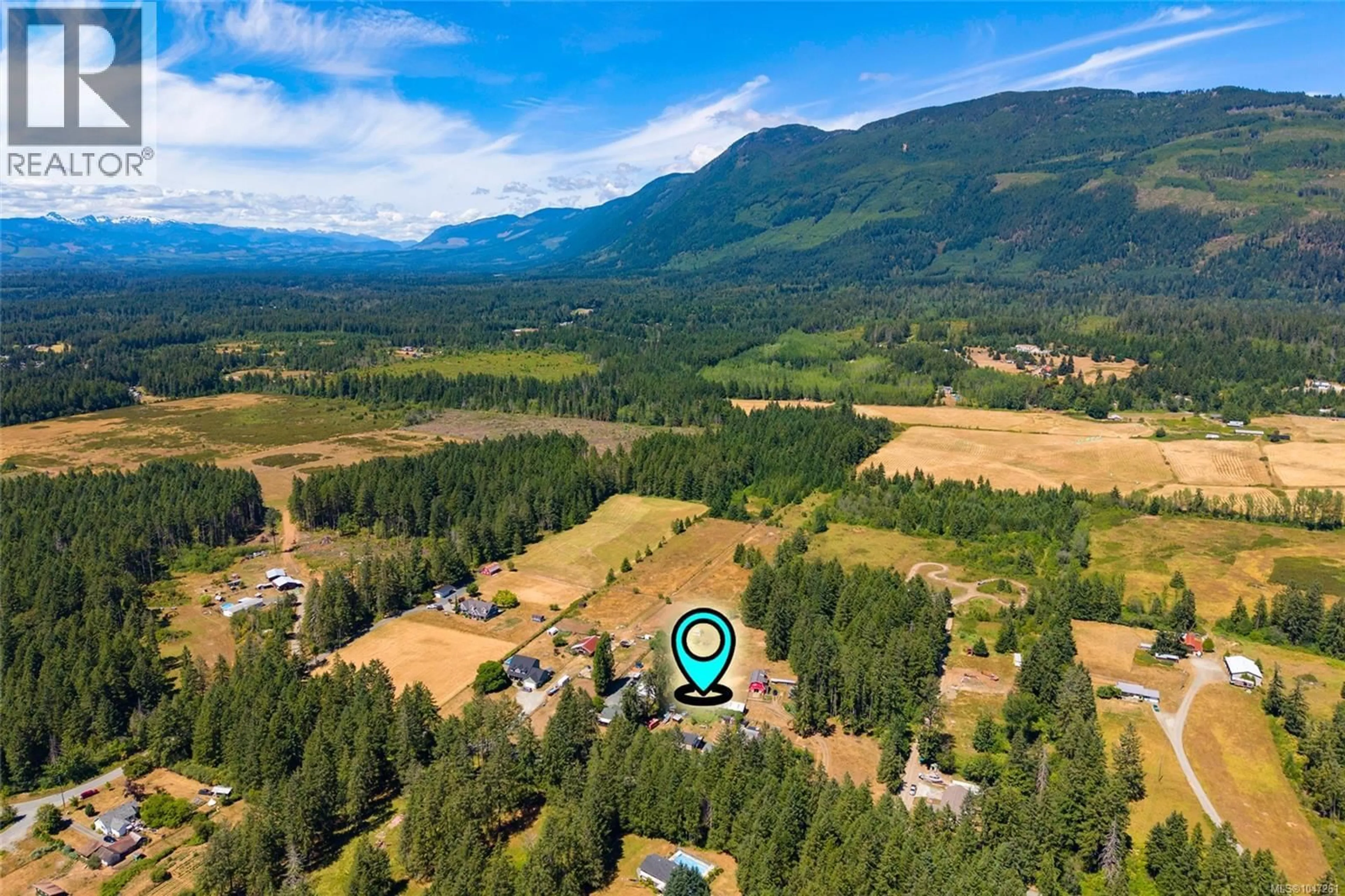 A pic from outside/outdoor area/front of a property/back of a property/a pic from drone, mountain view for 6379 SMITH ROAD, Port Alberni British Columbia V9Y8L8