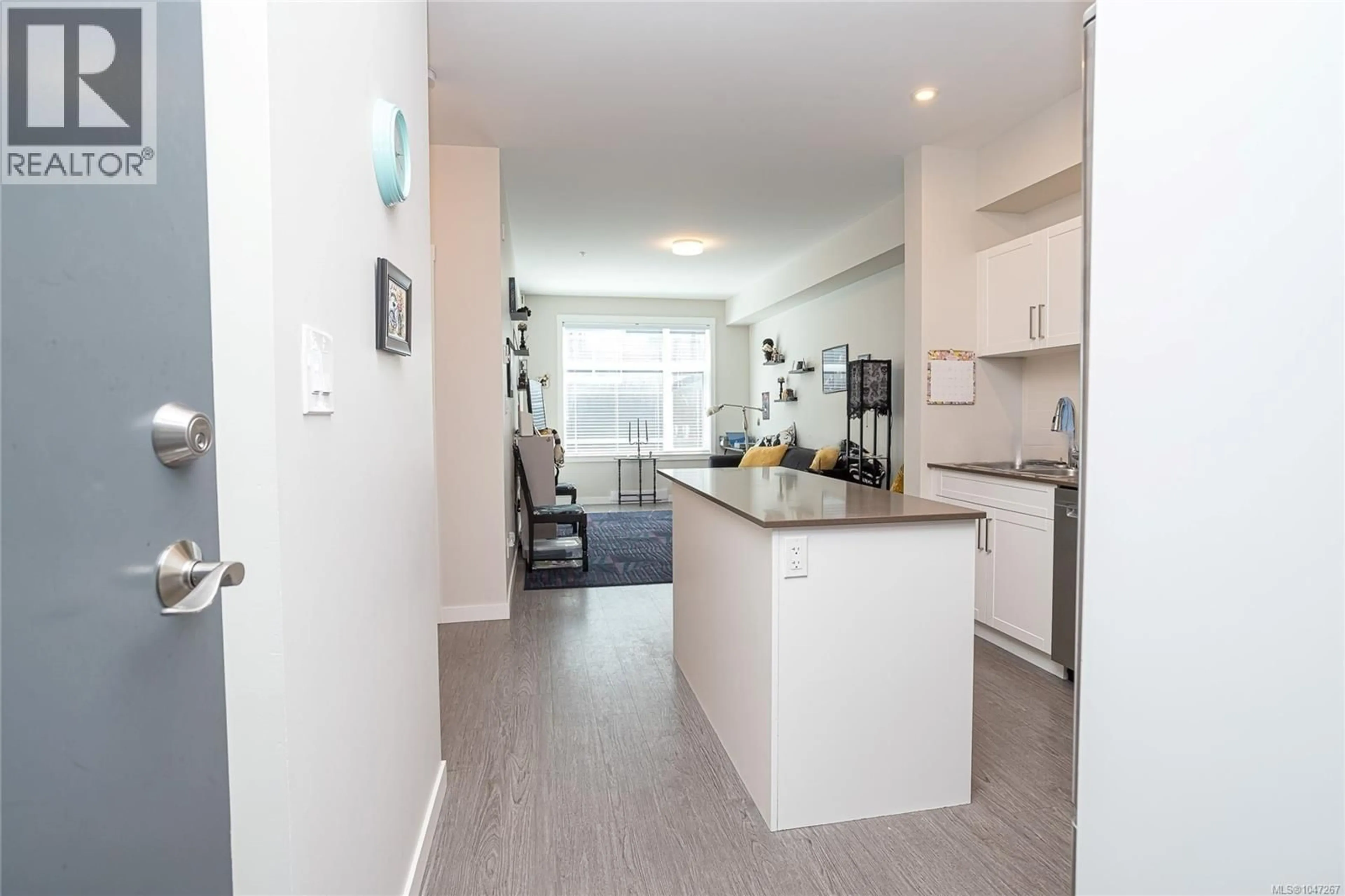 Open concept kitchen, wood/laminate floor for 408 - 868 ORONO AVENUE, Langford British Columbia V9B2T8