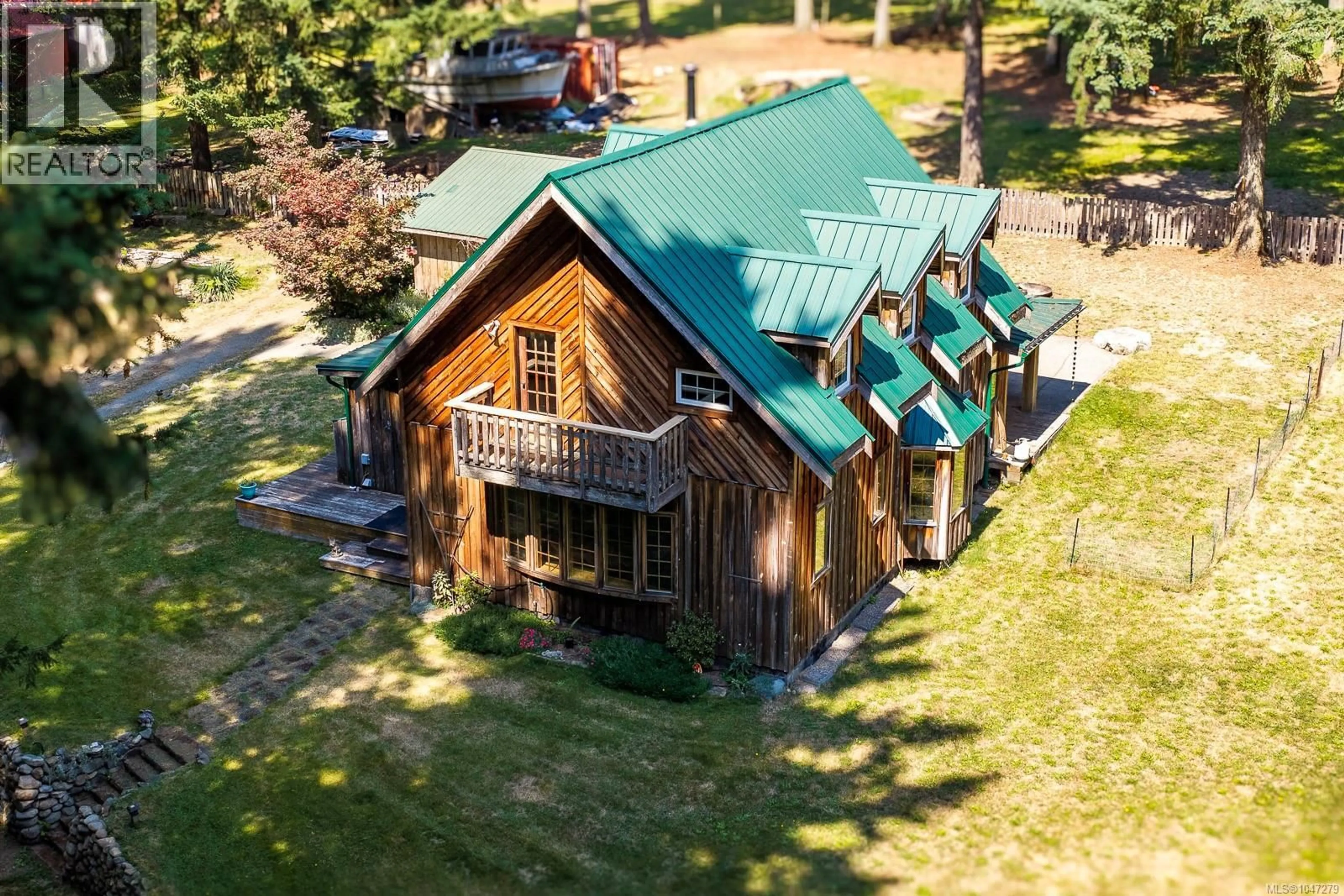 A pic from outside/outdoor area/front of a property/back of a property/a pic from drone, building for 1584 NURMI ROAD, Merville British Columbia V0R2M0
