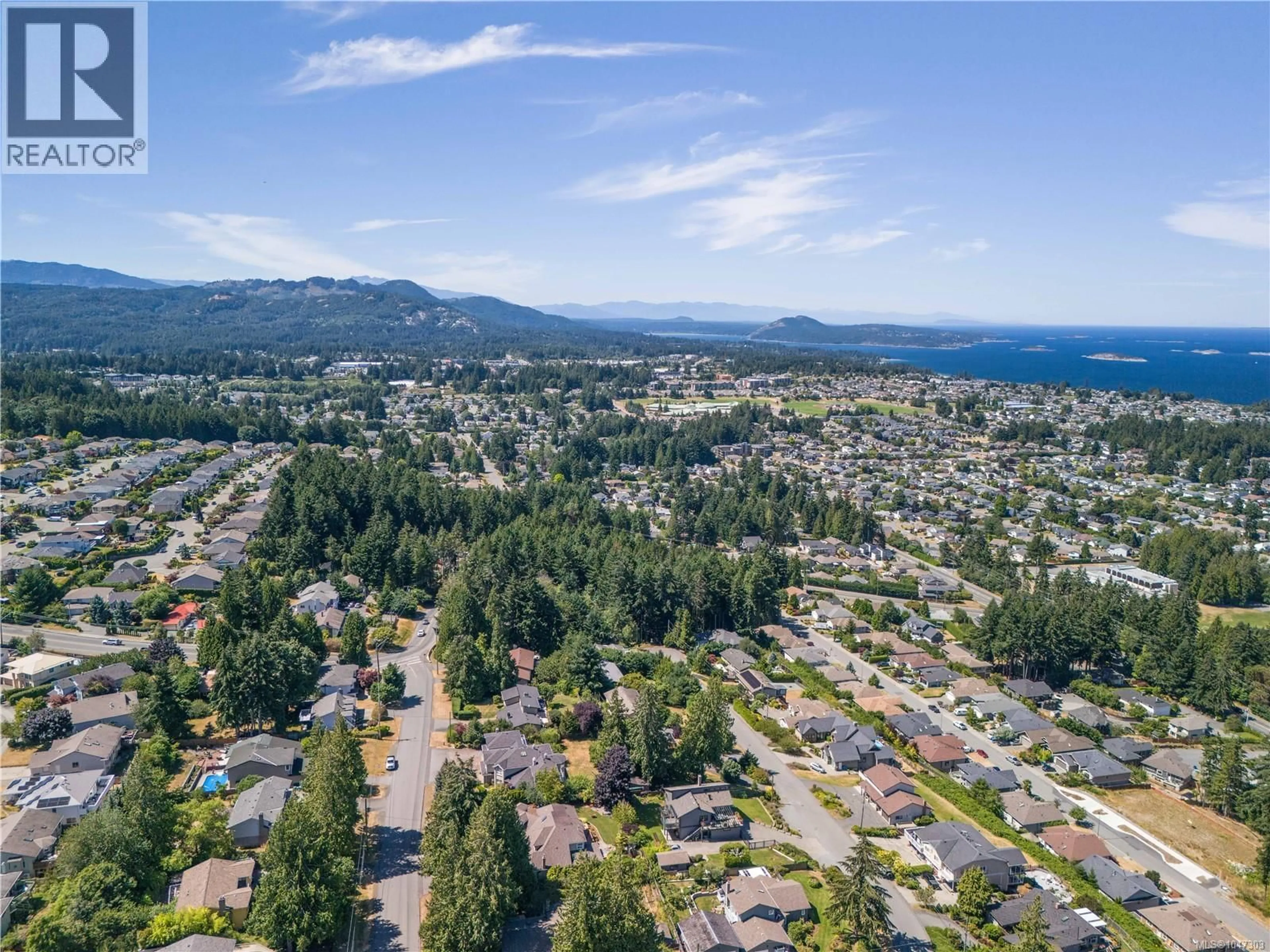 A pic from outside/outdoor area/front of a property/back of a property/a pic from drone, mountain view for 5650 ALDER WAY, Nanaimo British Columbia V9T5N4