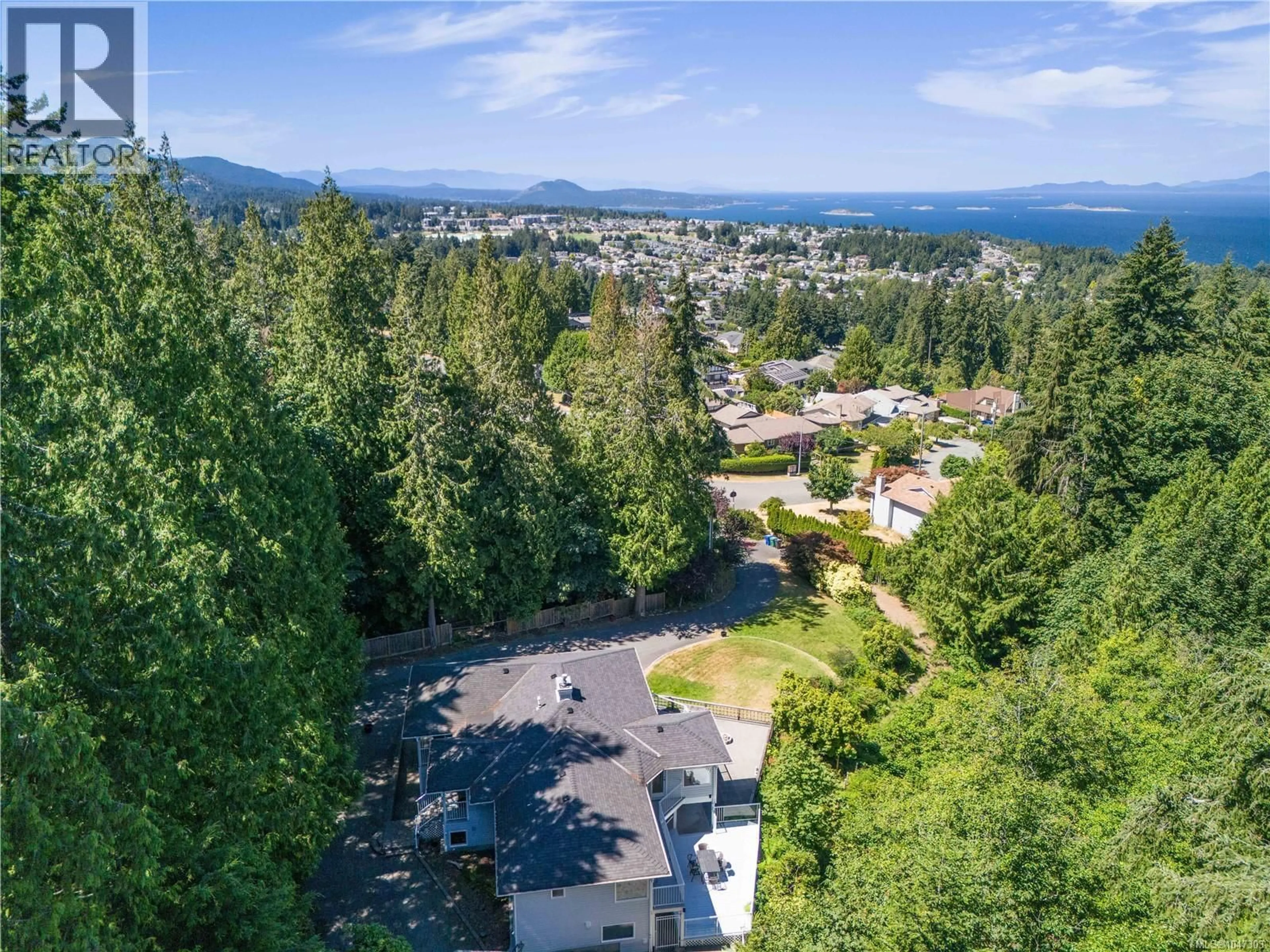 A pic from outside/outdoor area/front of a property/back of a property/a pic from drone, mountain view for 5650 ALDER WAY, Nanaimo British Columbia V9T5N4