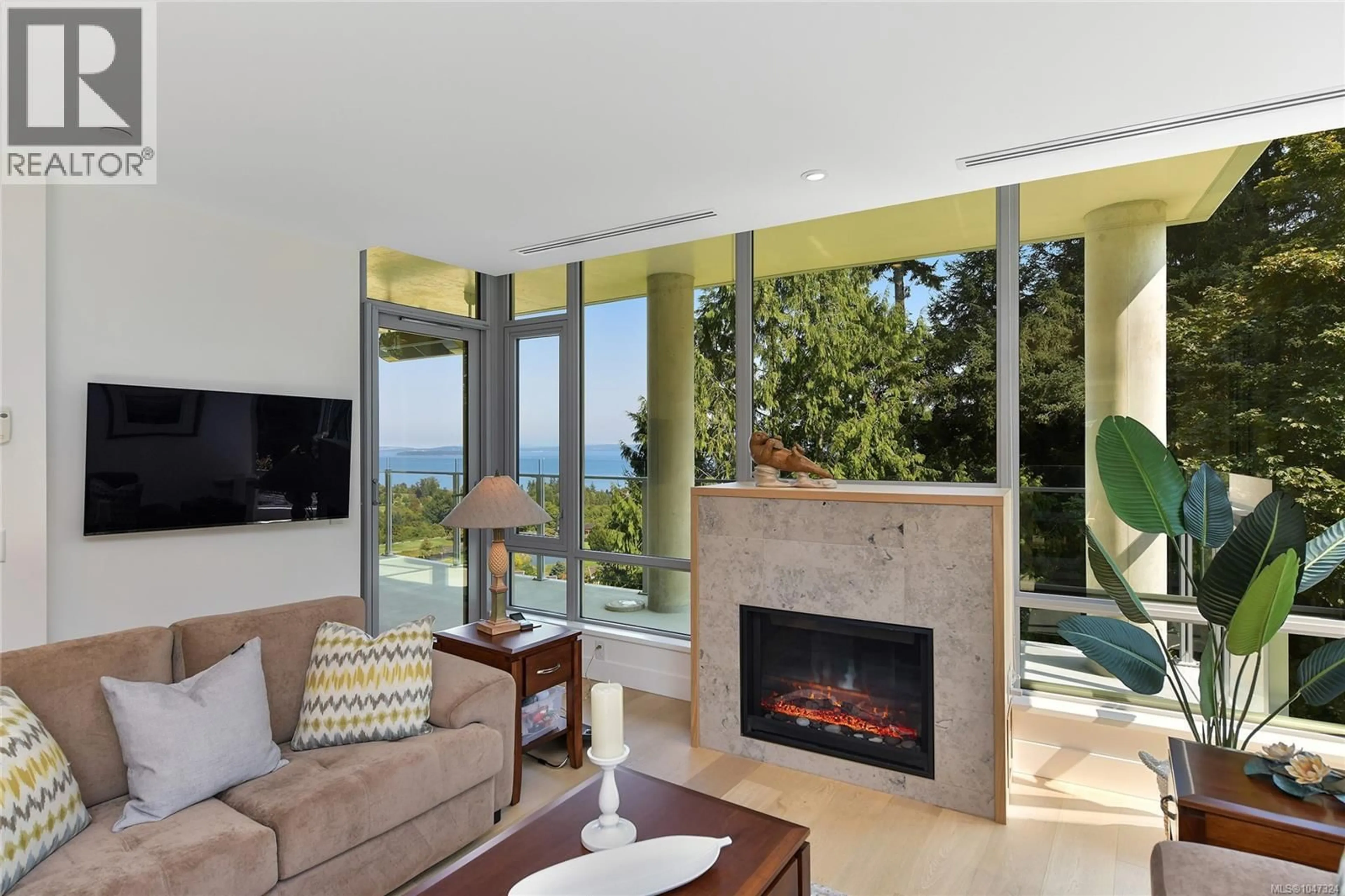 Living room with furniture, ceramic/tile floor for 406 - 5388 HILL RISE TERRACE, Saanich British Columbia V8Y3K2