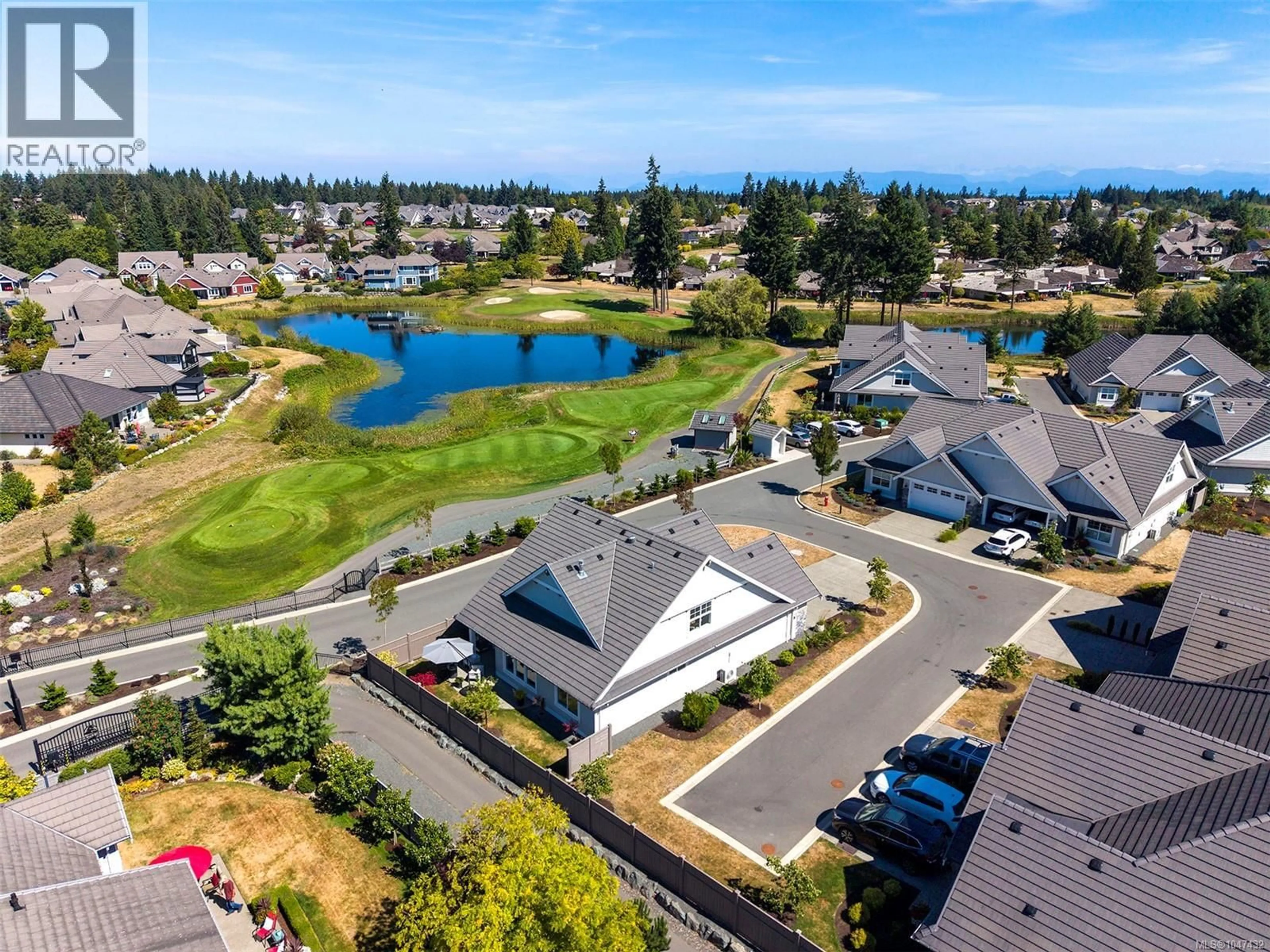 A pic from outside/outdoor area/front of a property/back of a property/a pic from drone, water/lake/river/ocean view for 101 - 1444 CROWN ISLE DRIVE, Courtenay British Columbia V9N0B8