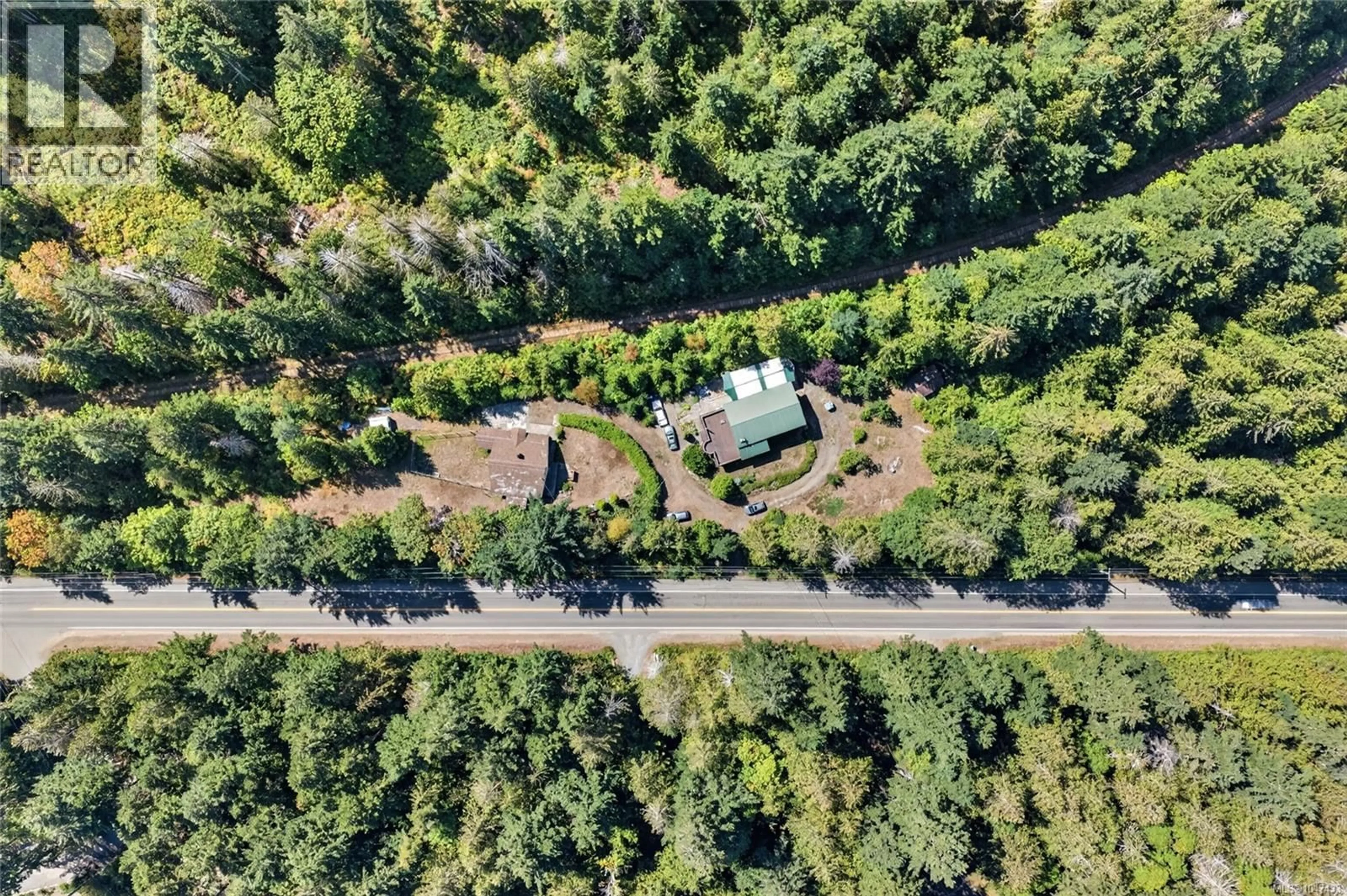 A pic from outside/outdoor area/front of a property/back of a property/a pic from drone, forest/trees view for 5154 ISLAND HIGHWAY WEST, Qualicum Beach British Columbia V9K1Z1