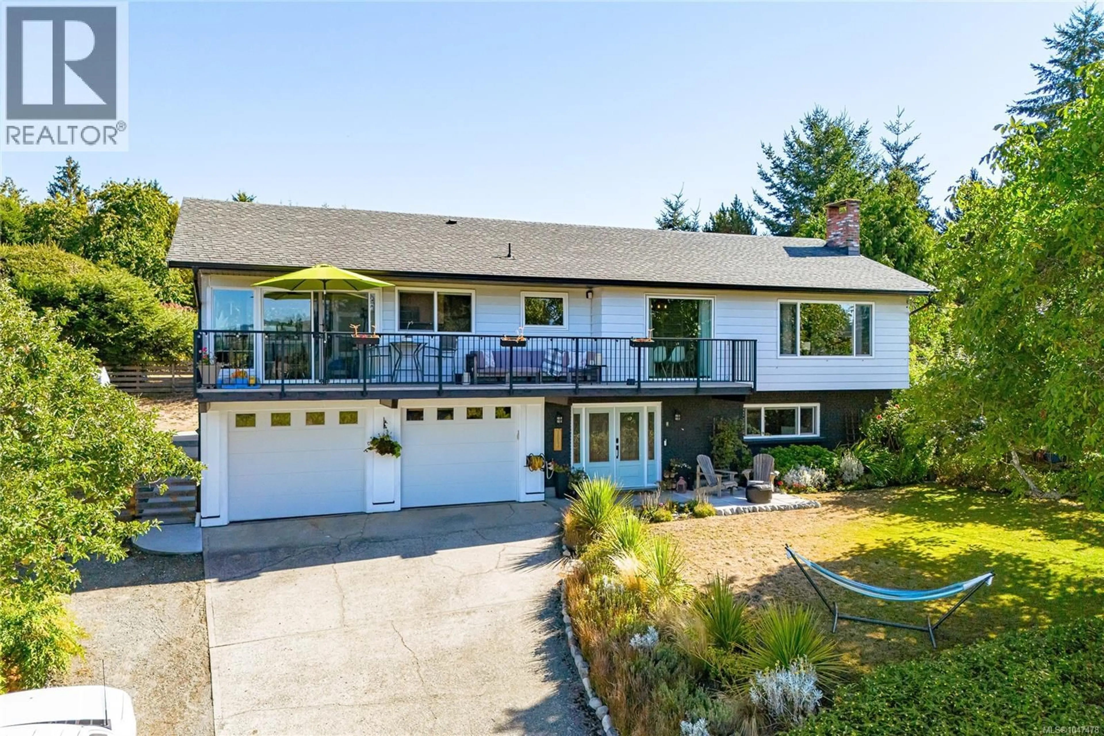A pic from outside/outdoor area/front of a property/back of a property/a pic from drone, water/lake/river/ocean view for 1854 MT. NEWTON CROSS ROAD, Central Saanich British Columbia V8M1L1