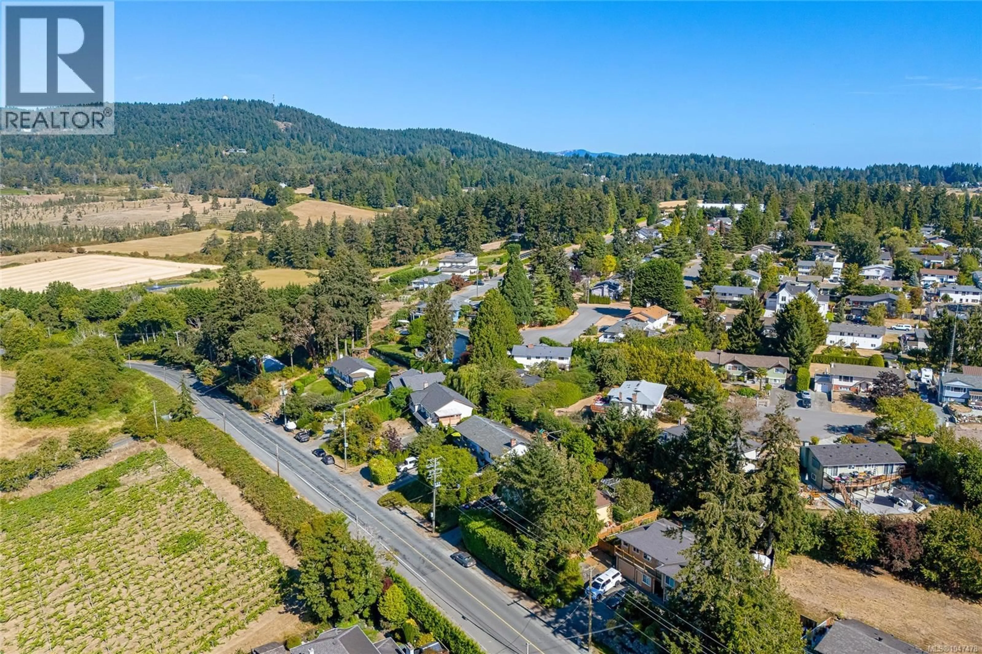 A pic from outside/outdoor area/front of a property/back of a property/a pic from drone, mountain view for 1854 MT. NEWTON CROSS ROAD, Central Saanich British Columbia V8M1L1