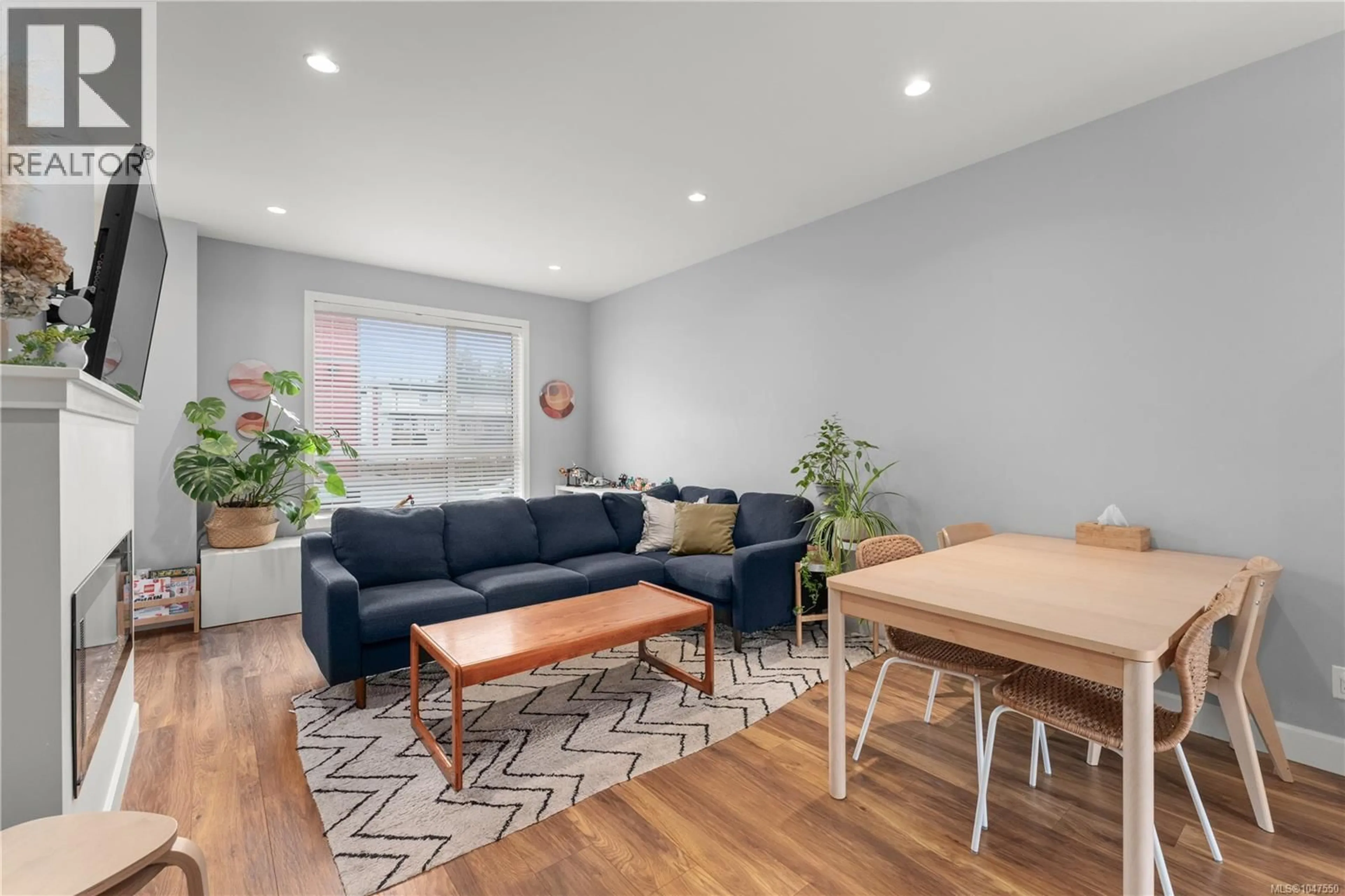 Living room with furniture, wood/laminate floor for 402 - 3351 LUXTON ROAD, Langford British Columbia V9C0P2