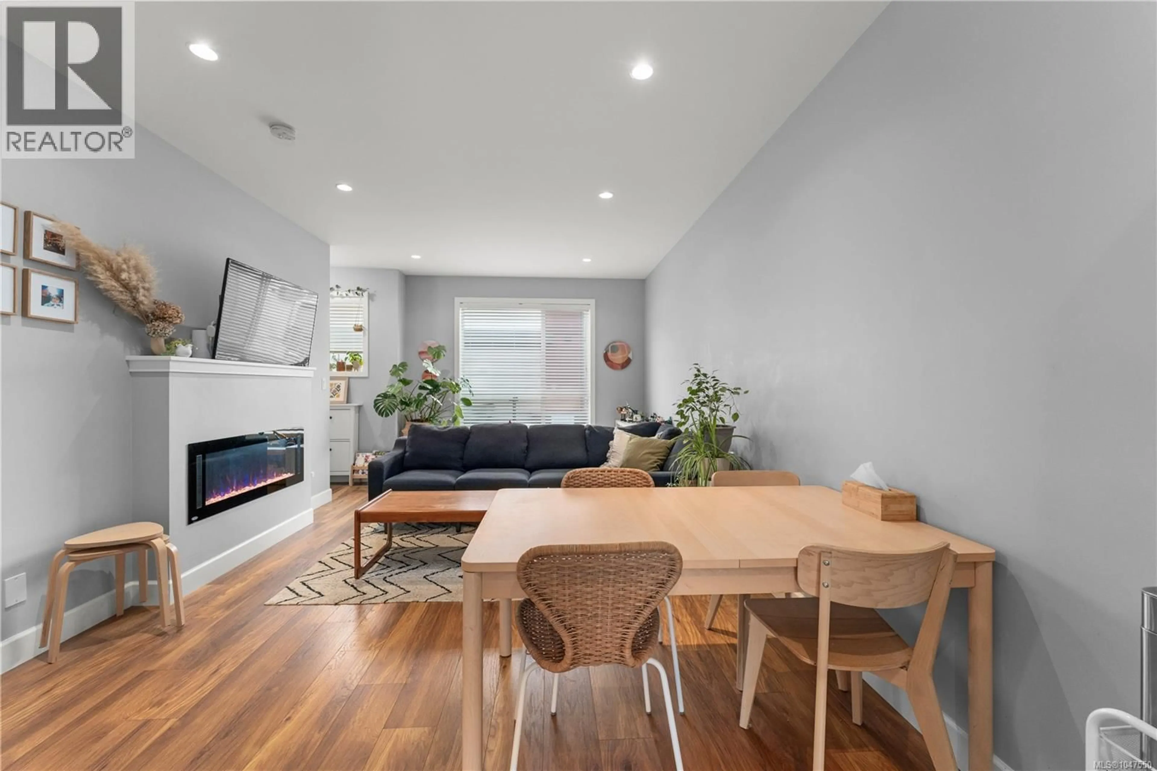 Living room with furniture, wood/laminate floor for 402 - 3351 LUXTON ROAD, Langford British Columbia V9C0P2