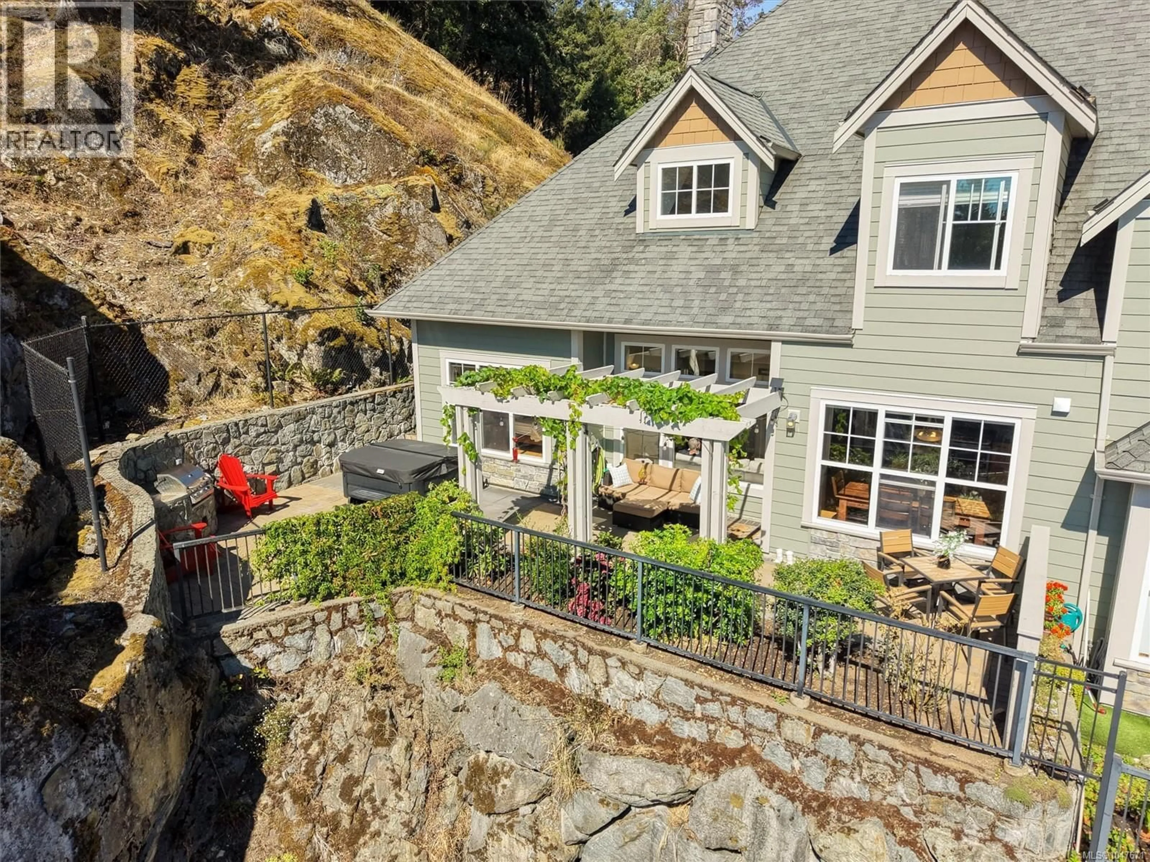 A pic from outside/outdoor area/front of a property/back of a property/a pic from drone, unknown for 102 - 945 BEAR MOUNTAIN PARKWAY, Langford British Columbia V9B6T1