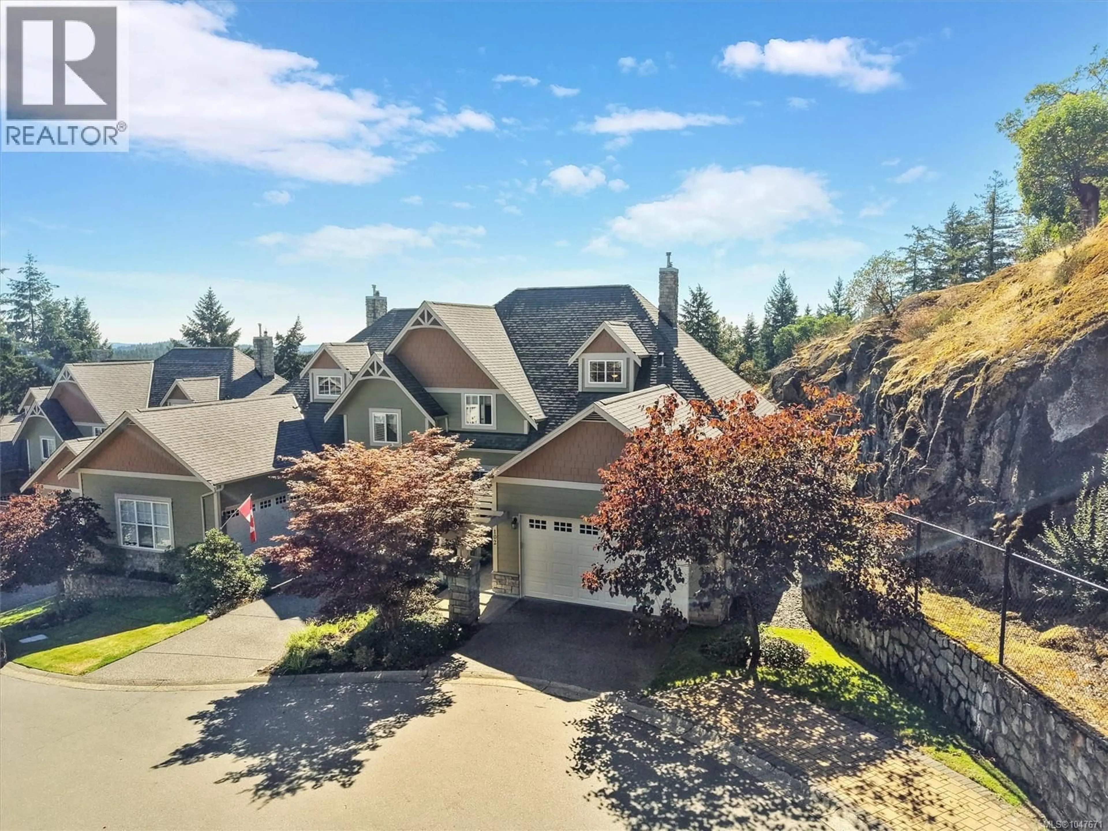 A pic from outside/outdoor area/front of a property/back of a property/a pic from drone, street for 102 - 945 BEAR MOUNTAIN PARKWAY, Langford British Columbia V9B6T1