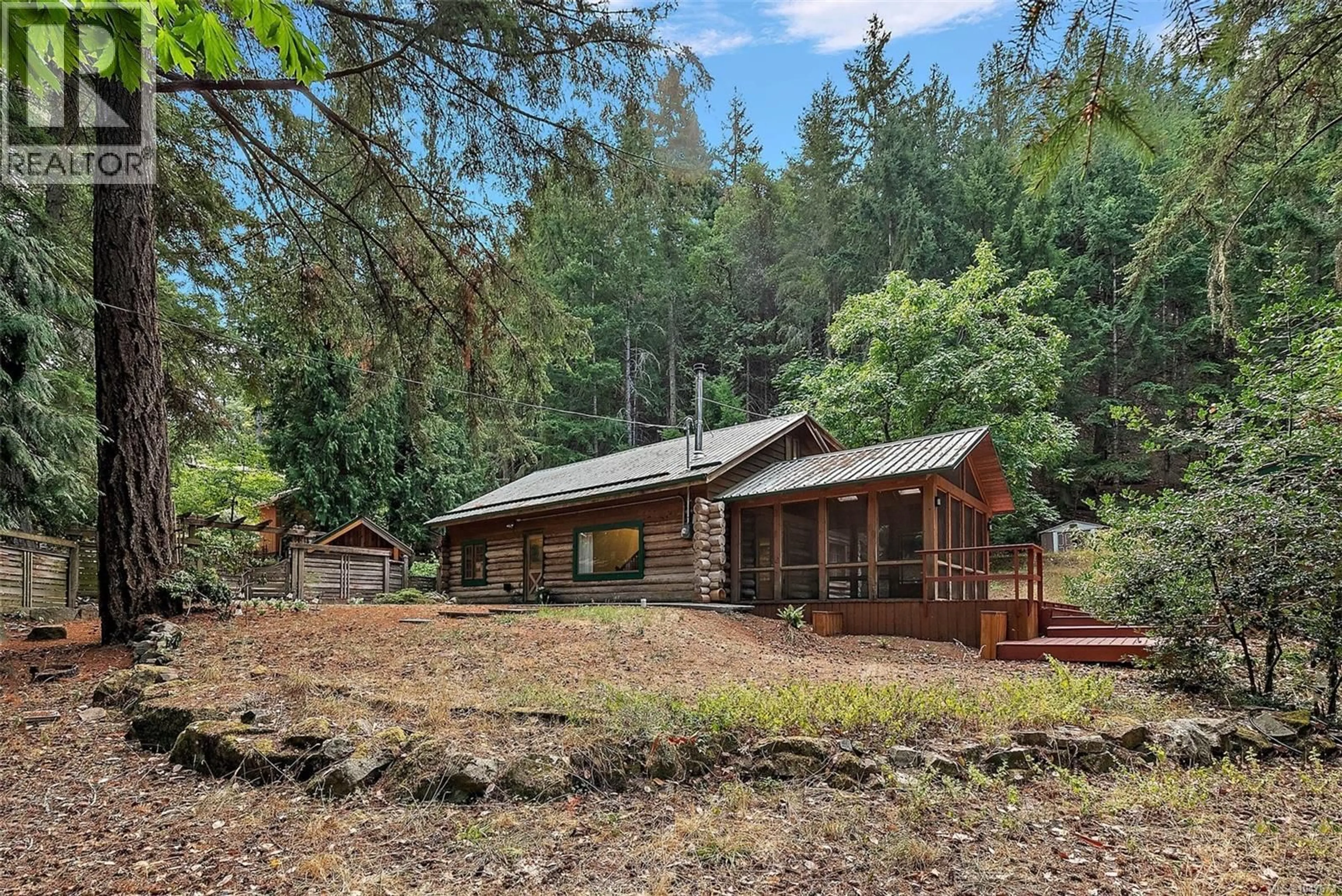 A pic from outside/outdoor area/front of a property/back of a property/a pic from drone, forest/trees view for 135 FAIRWAY DRIVE, Salt Spring British Columbia V8K1M6