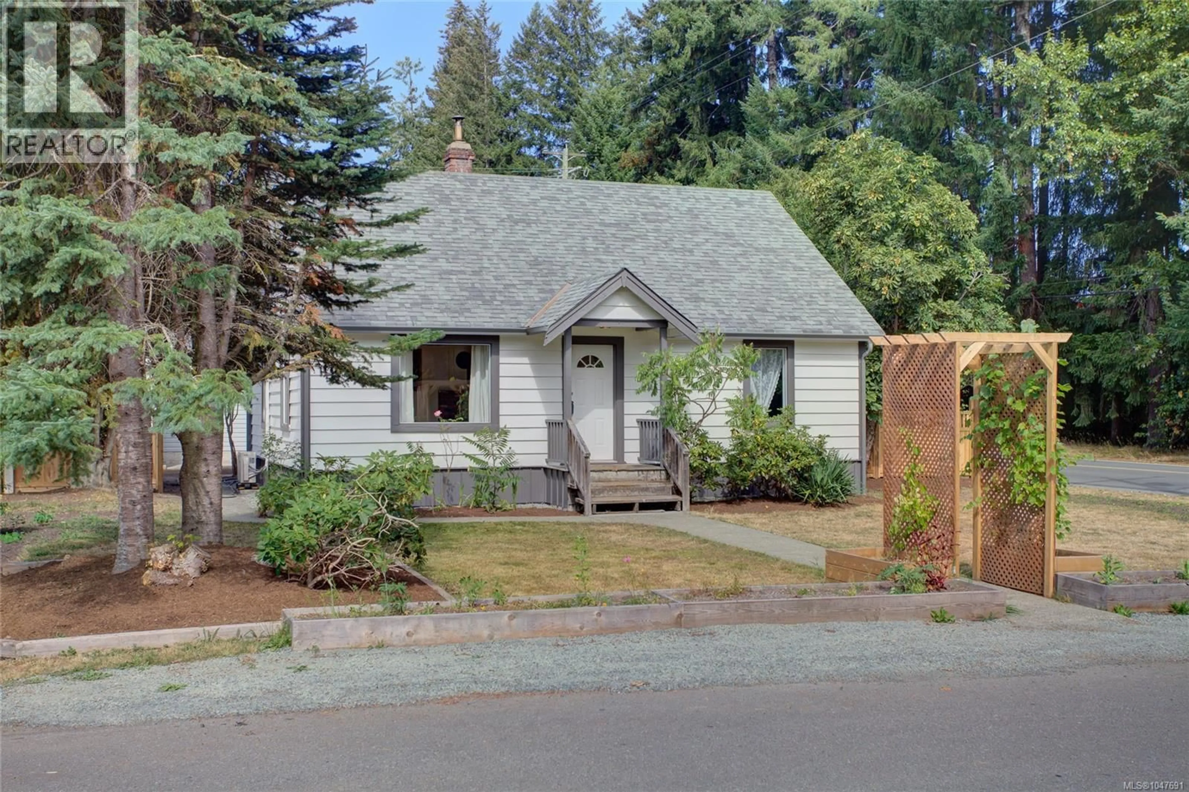 Home with vinyl exterior material, street for 6810 THIRD STREET, Honeymoon Bay British Columbia V0R1Y0