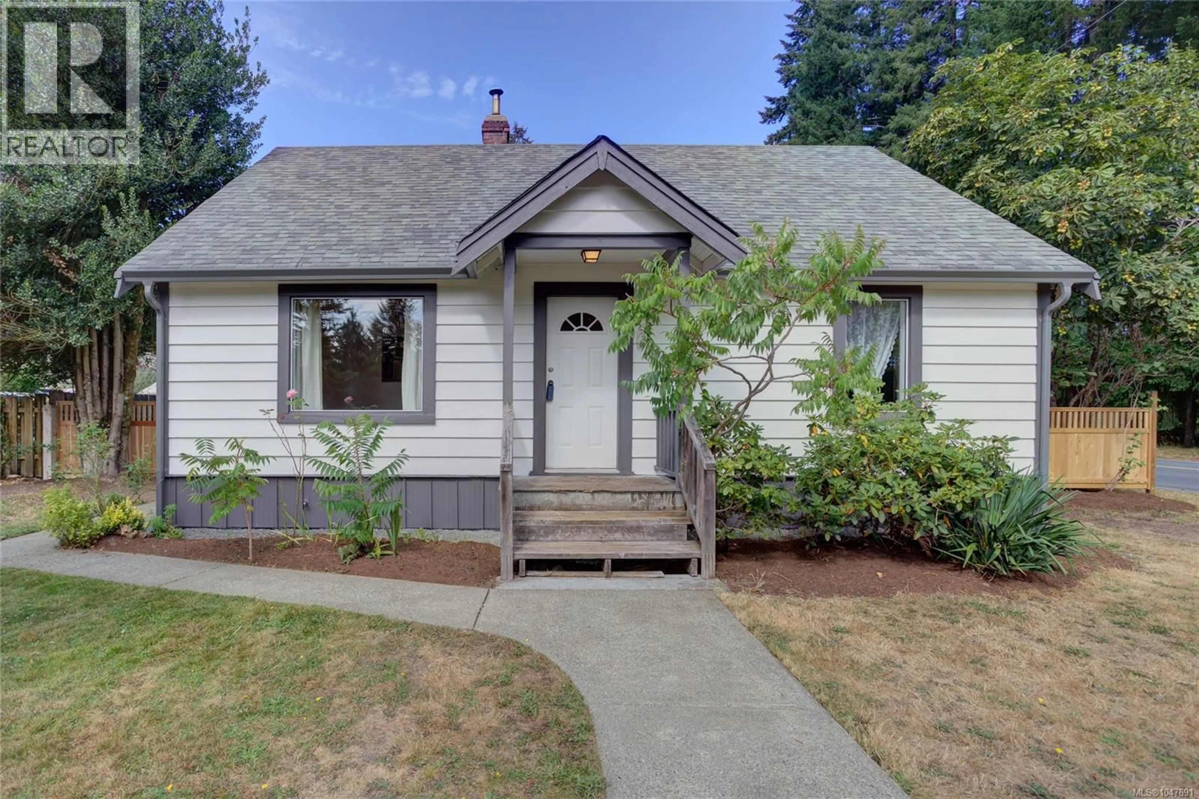 Home with vinyl exterior material, street for 6810 THIRD STREET, Honeymoon Bay British Columbia V0R1Y0