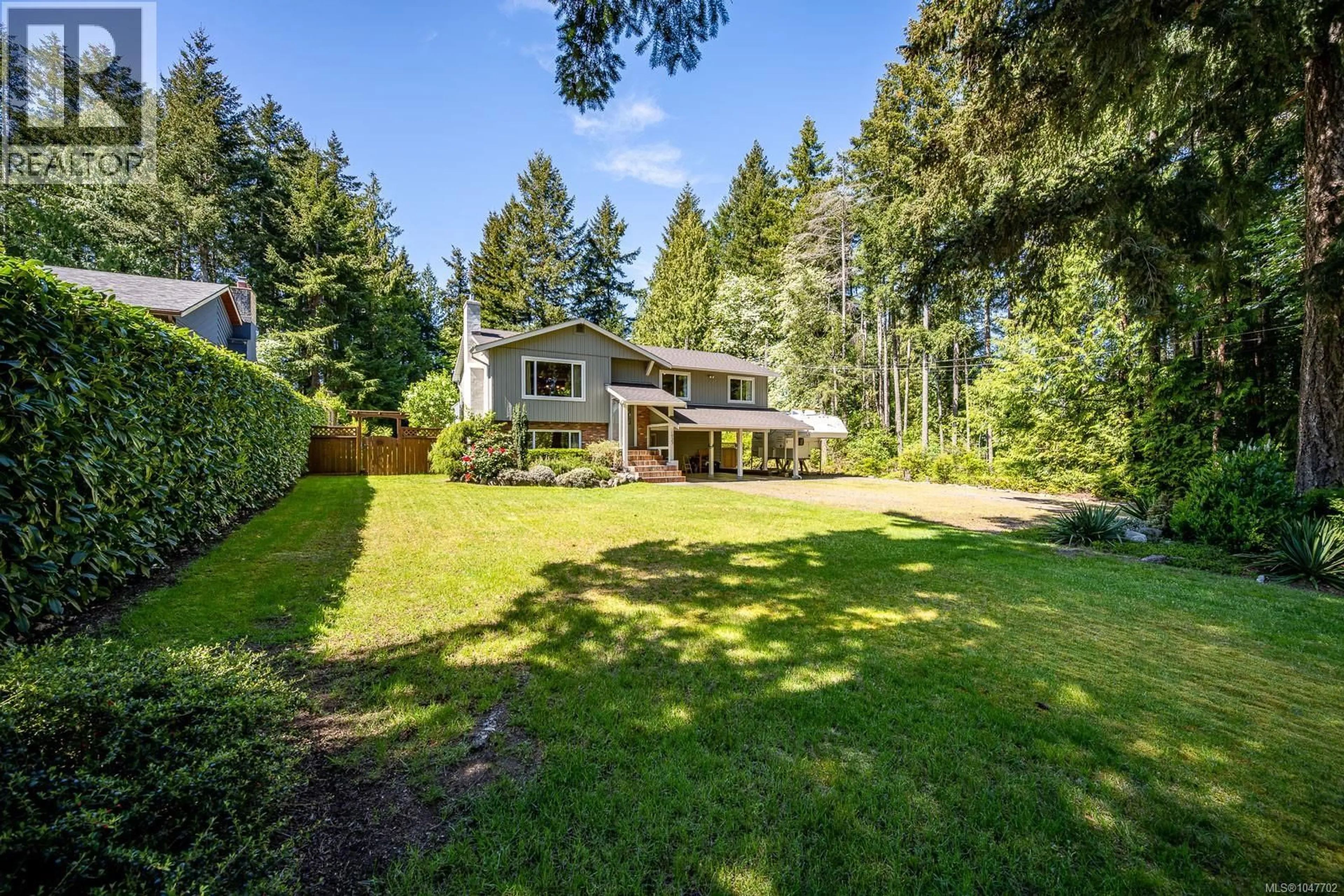 A pic from outside/outdoor area/front of a property/back of a property/a pic from drone, forest/trees view for 1023 SYLVAN ROAD, Comox British Columbia V9M3Z1