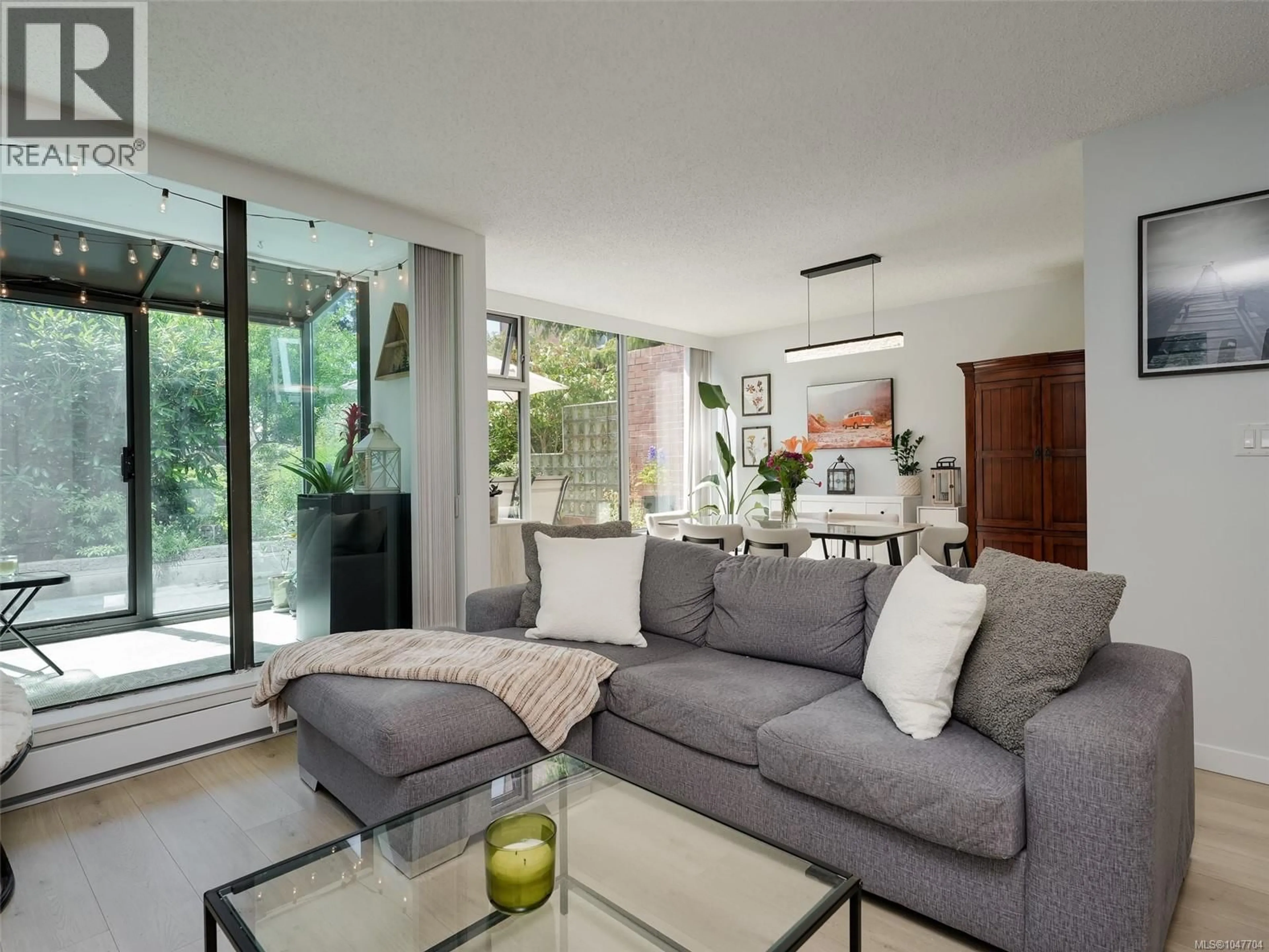 Living room with furniture, cement floor for 103 - 327 MAITLAND STREET, Victoria British Columbia V9A7G7