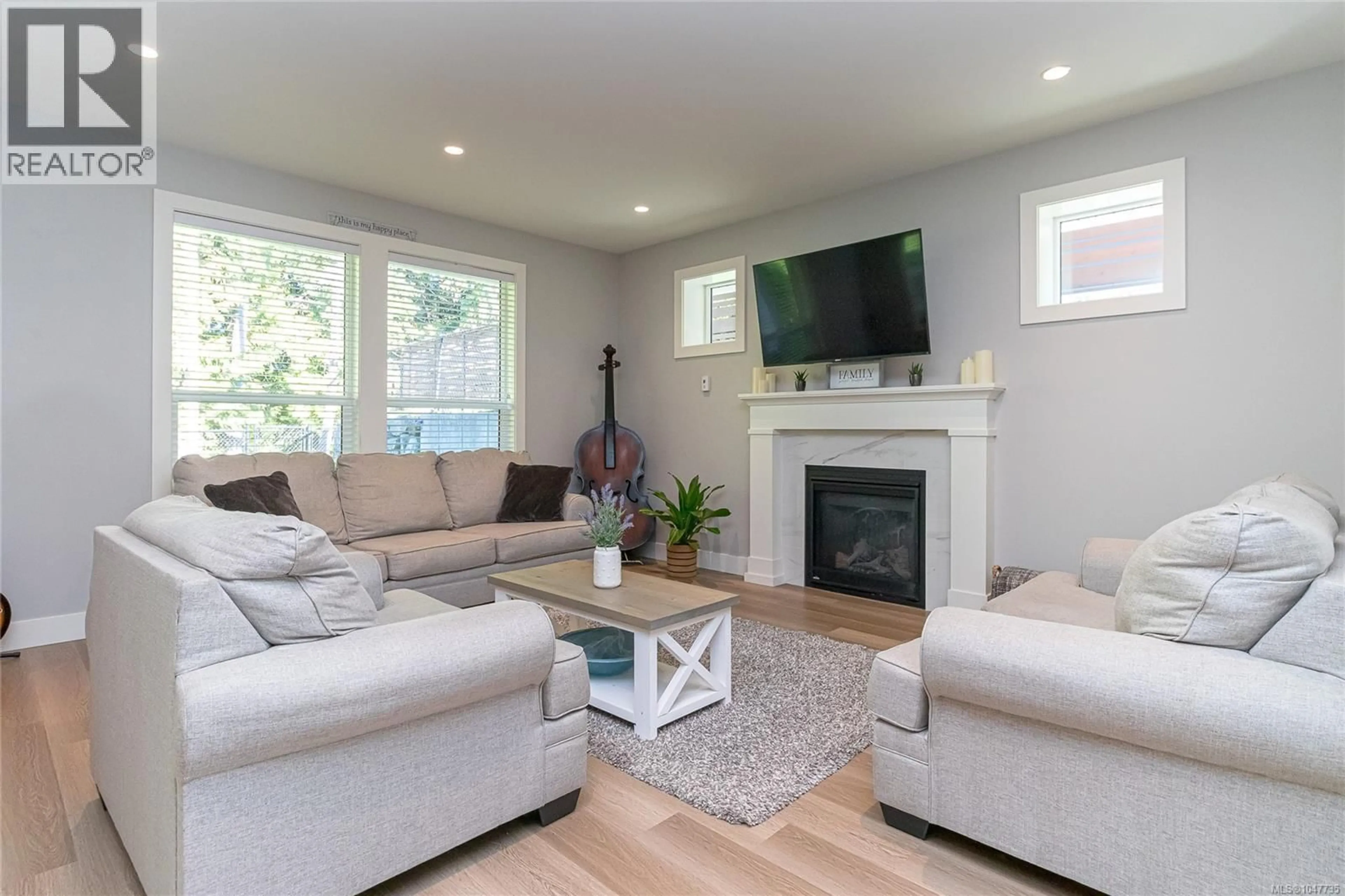 Living room with furniture, wood/laminate floor for 2121 TRIANGLE TRAIL, Langford British Columbia V9C0R2