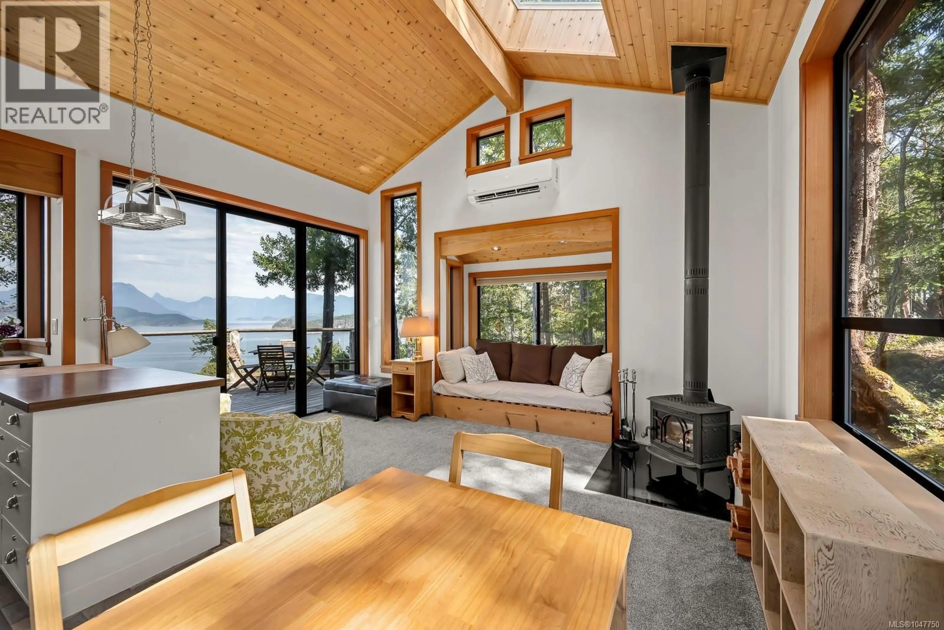 Living room with furniture, wood/laminate floor for 1710 TIBER BAY ROAD, Cortes Island British Columbia V0P1K0