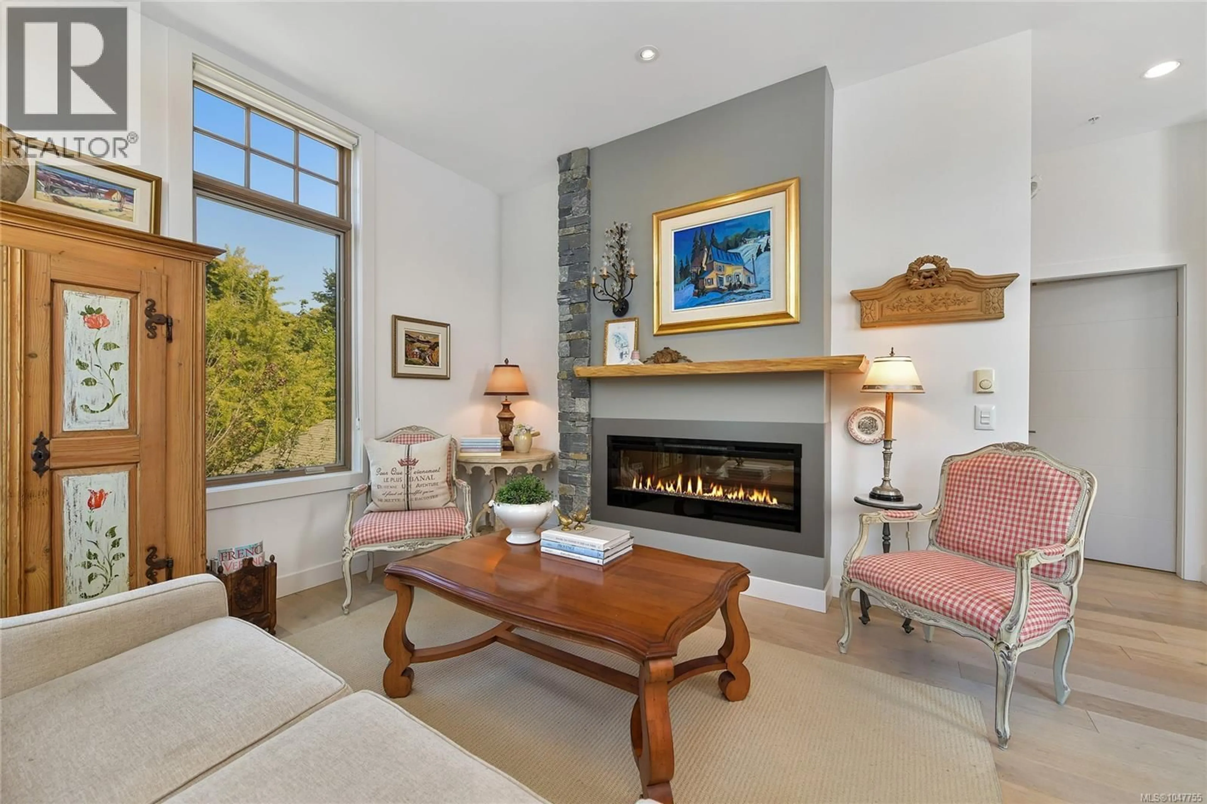 Living room with furniture, unknown for 301 - 2580 PENRHYN STREET, Saanich British Columbia V8N1G3
