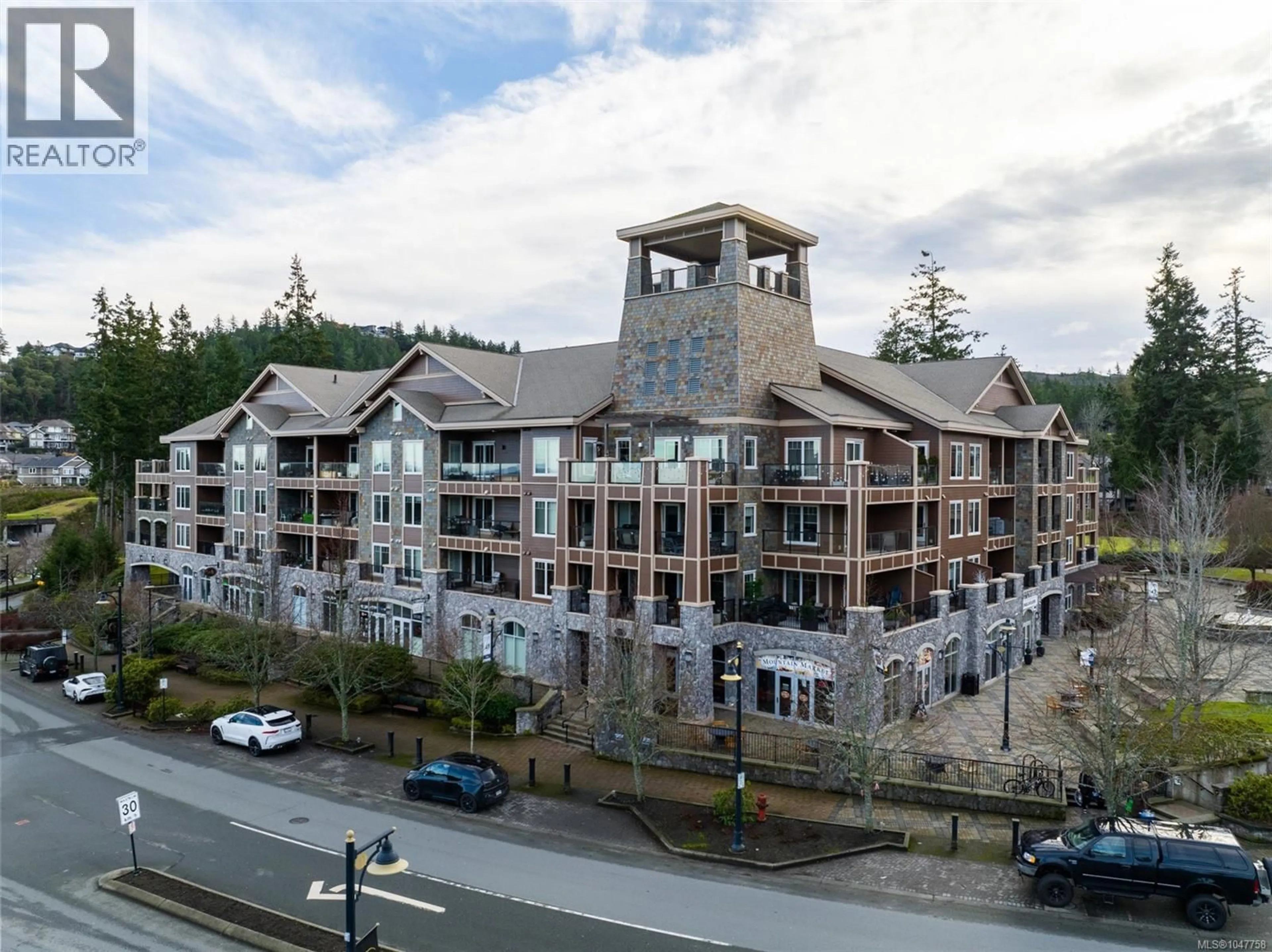 A pic from outside/outdoor area/front of a property/back of a property/a pic from drone, mountain view for 211 - 1325 BEAR MOUNTAIN PARKWAY, Langford British Columbia V9B6T8
