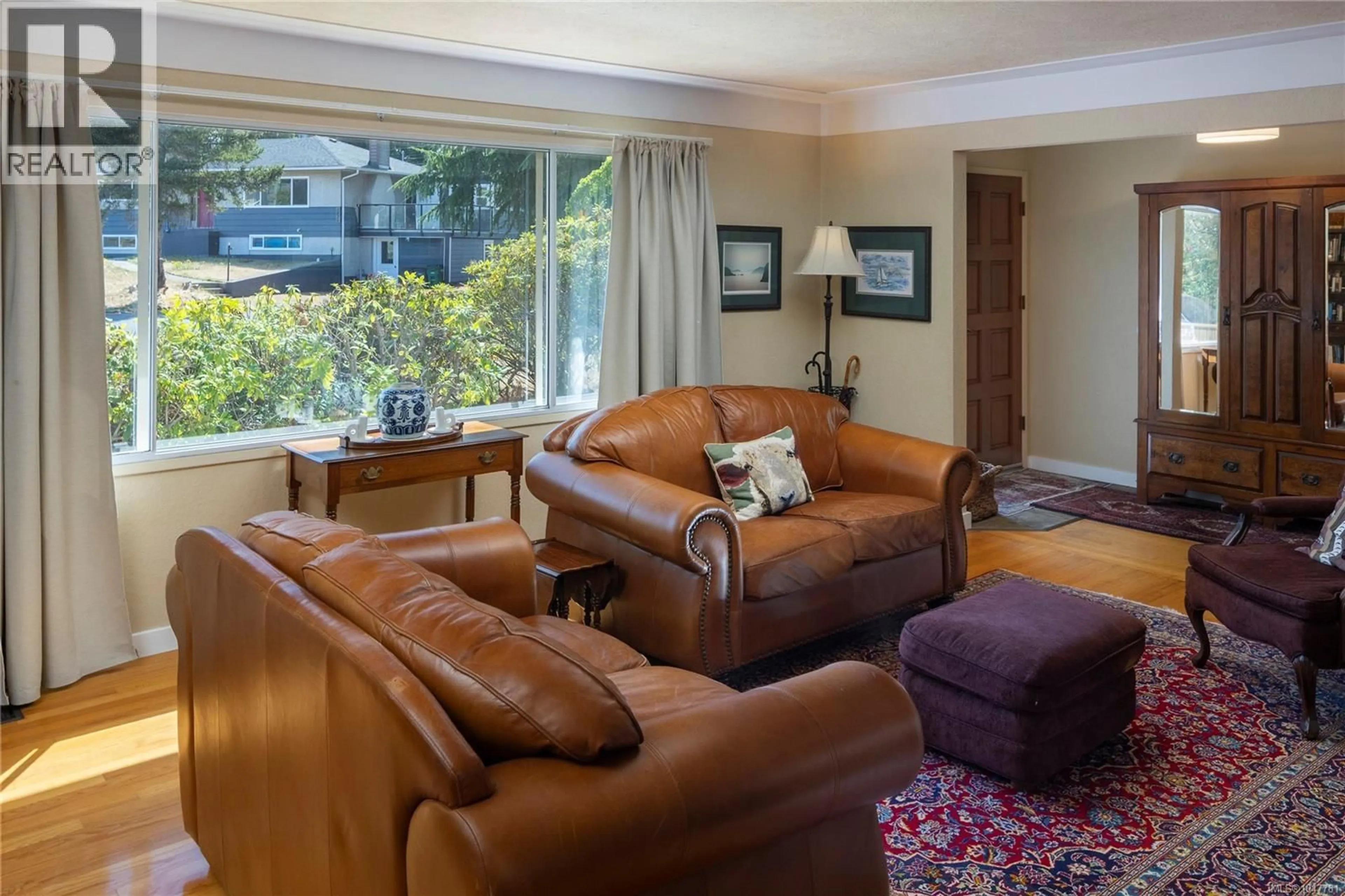 Living room with furniture, unknown for 1787 PENSHURST ROAD, Saanich British Columbia V8N2N6