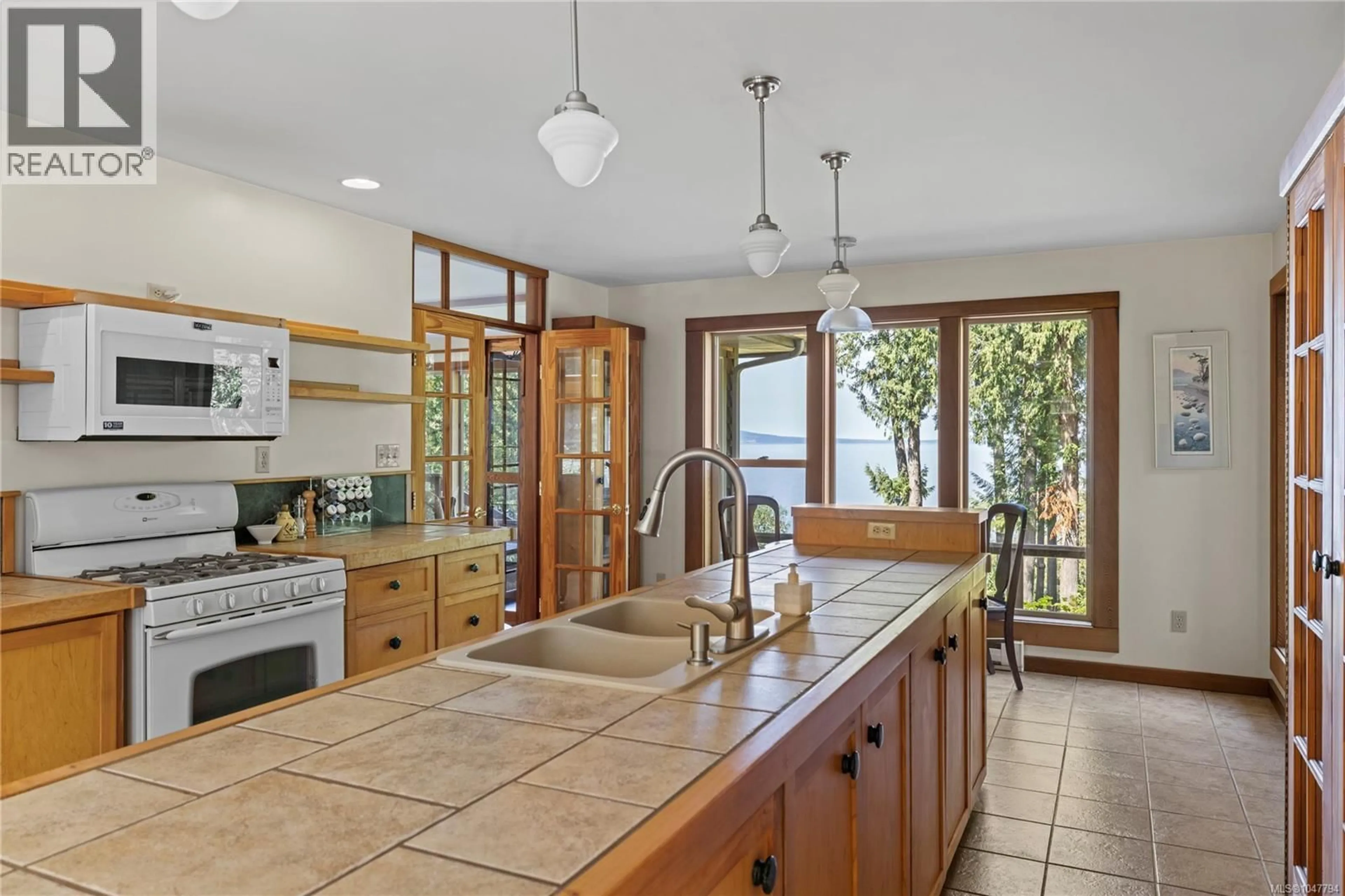 Open concept kitchen, ceramic/tile floor for 2185 WIDGEON ROAD, Qualicum Beach British Columbia V9K1Y8
