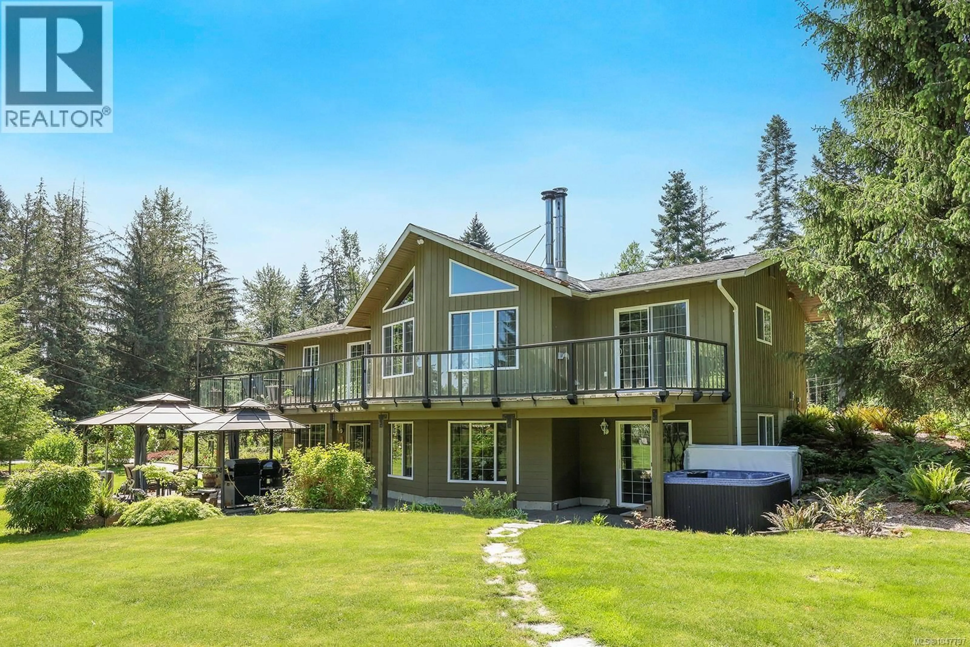 A pic from outside/outdoor area/front of a property/back of a property/a pic from drone, water/lake/river/ocean view for 5427 WILDWOOD ROAD, Courtenay British Columbia V9J1P5