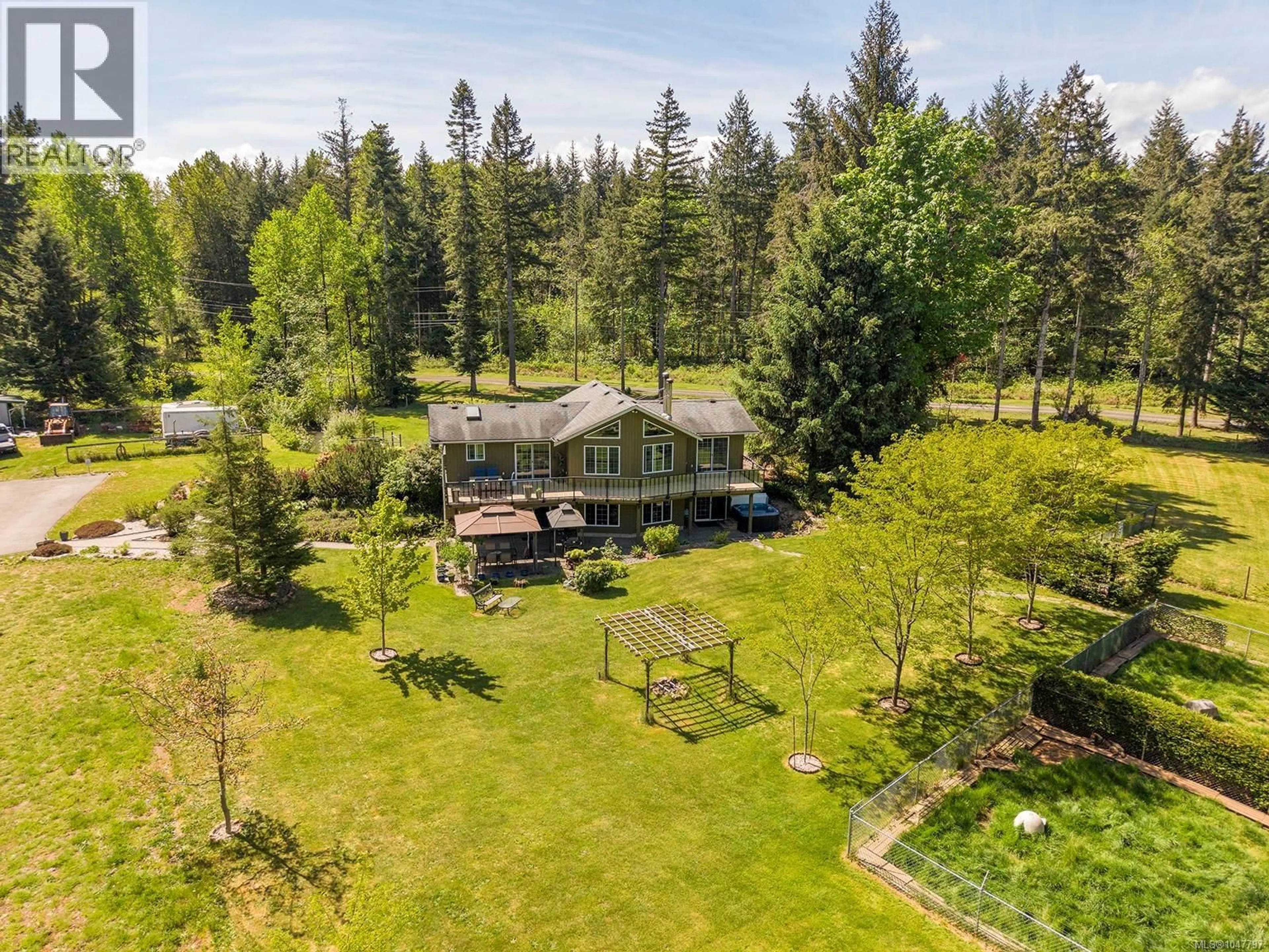 A pic from outside/outdoor area/front of a property/back of a property/a pic from drone, forest/trees view for 5427 WILDWOOD ROAD, Courtenay British Columbia V9J1P5