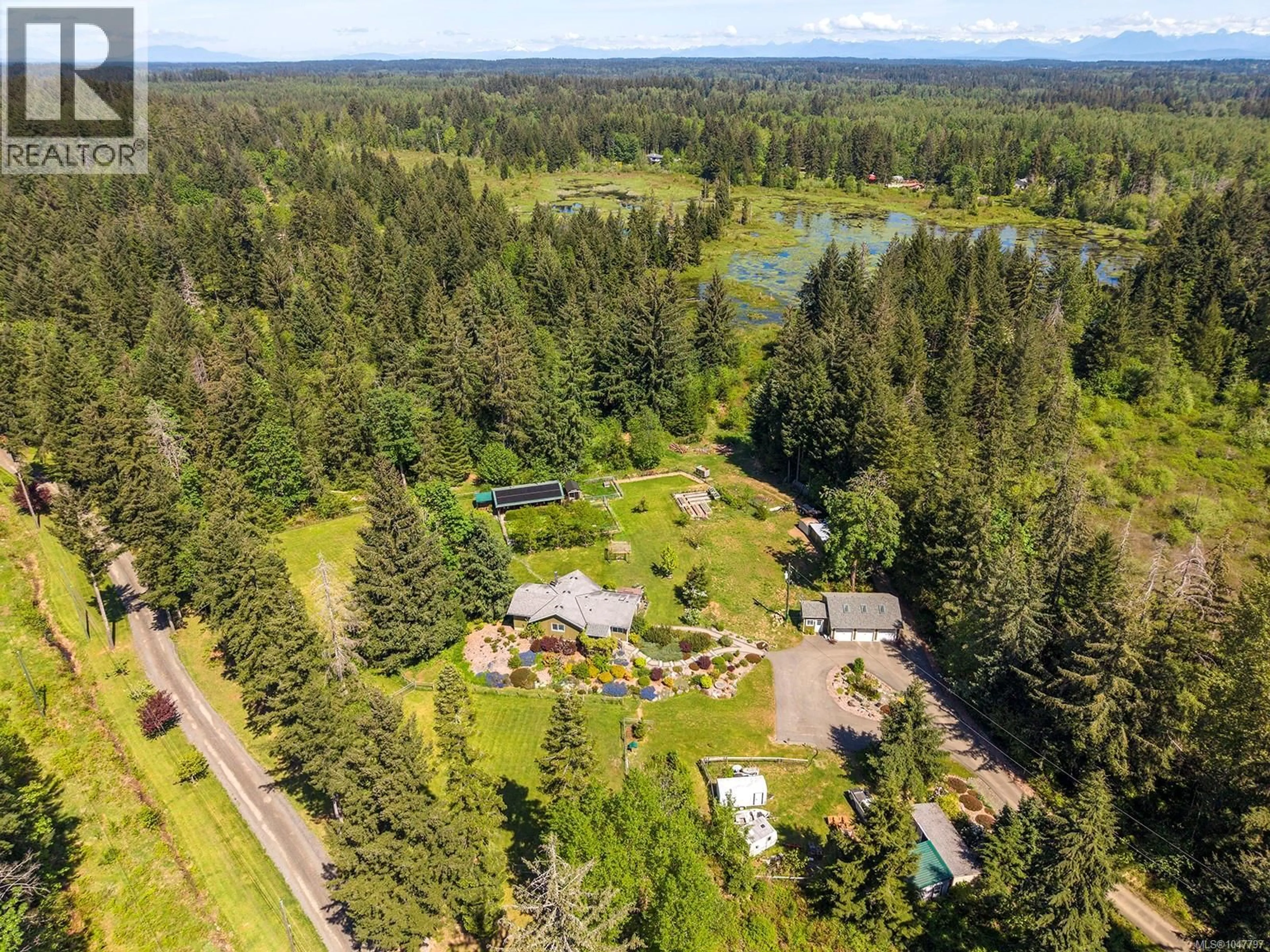 A pic from outside/outdoor area/front of a property/back of a property/a pic from drone, water/lake/river/ocean view for 5427 WILDWOOD ROAD, Courtenay British Columbia V9J1P5
