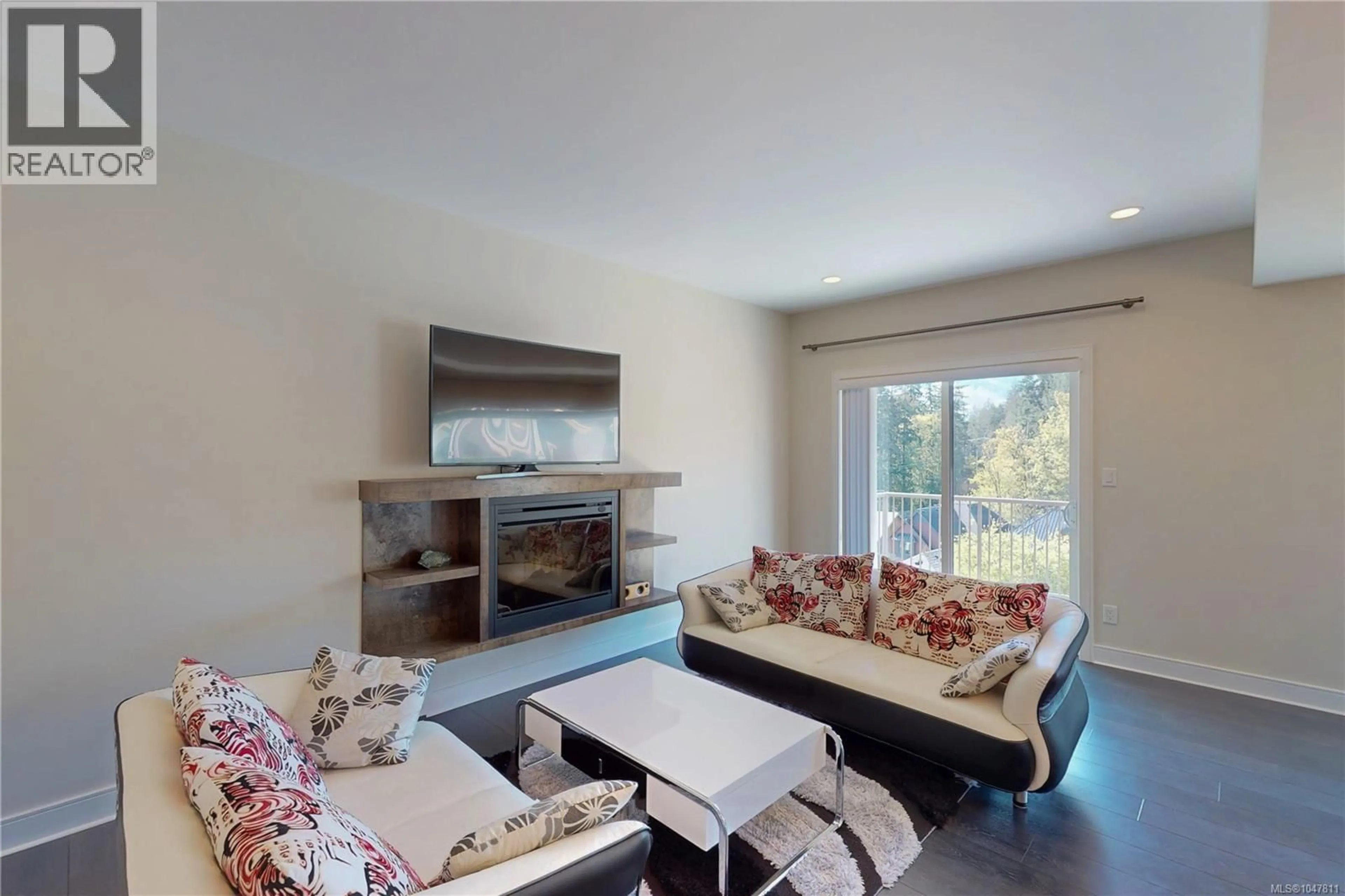 Living room with furniture, wood/laminate floor for 1262 BOMBARDIER CRESCENT, Langford British Columbia V9B0R4
