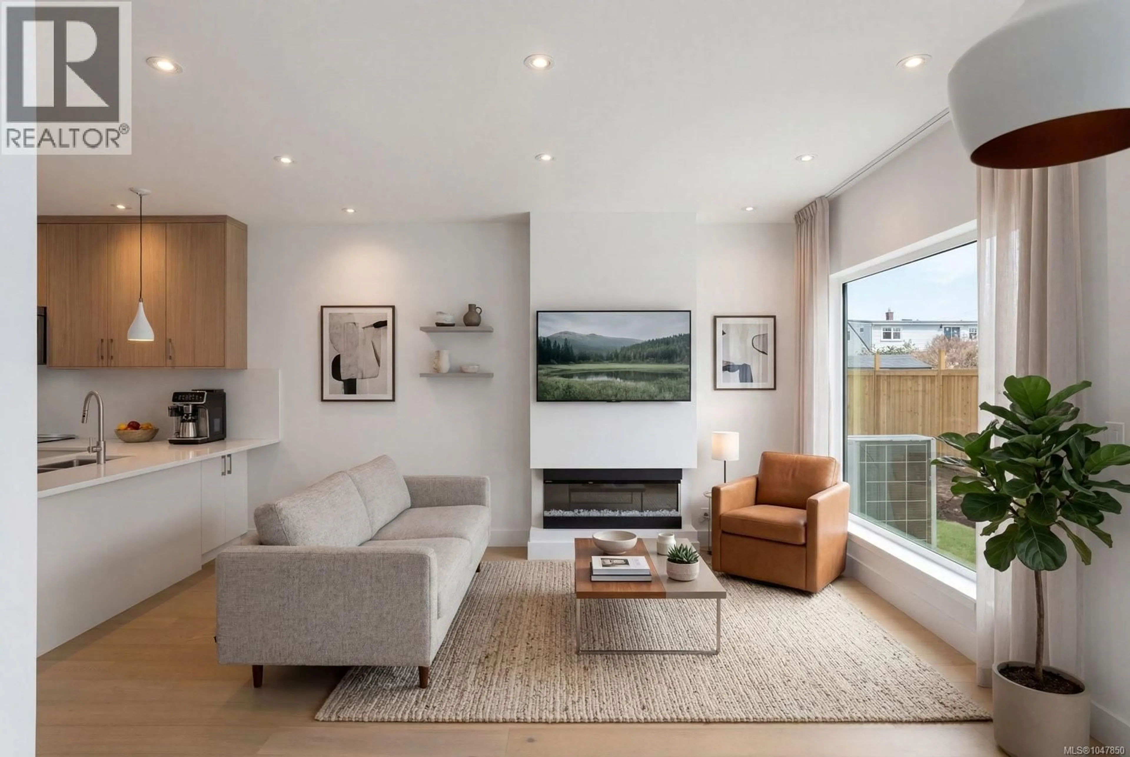 Living room with furniture, wood/laminate floor for 3 - 2118 PENTLAND ROAD, Oak Bay British Columbia V8S2W4