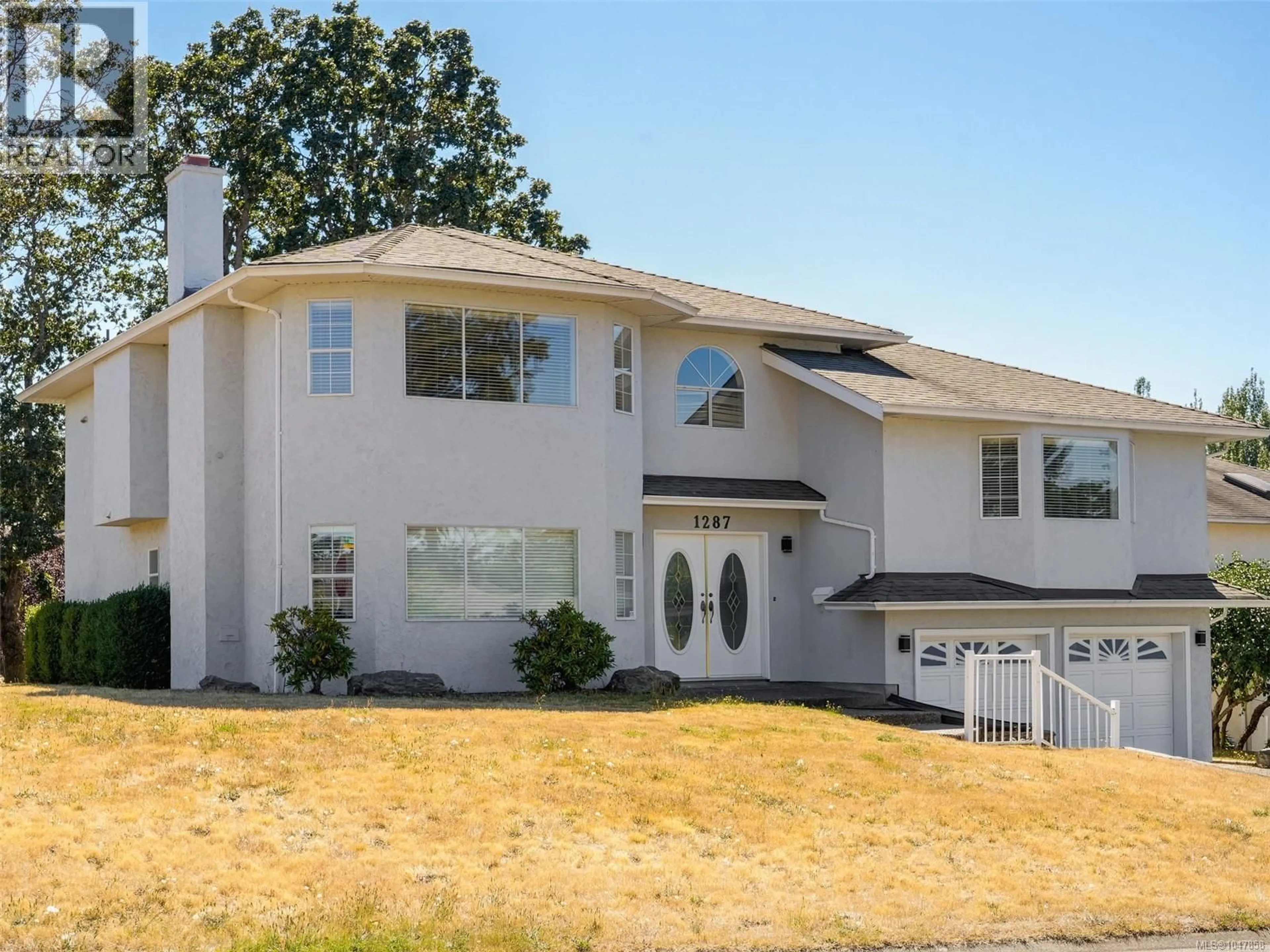 Home with vinyl exterior material, street for 1287 CARMICHAEL COURT, Saanich British Columbia V8Z7B9