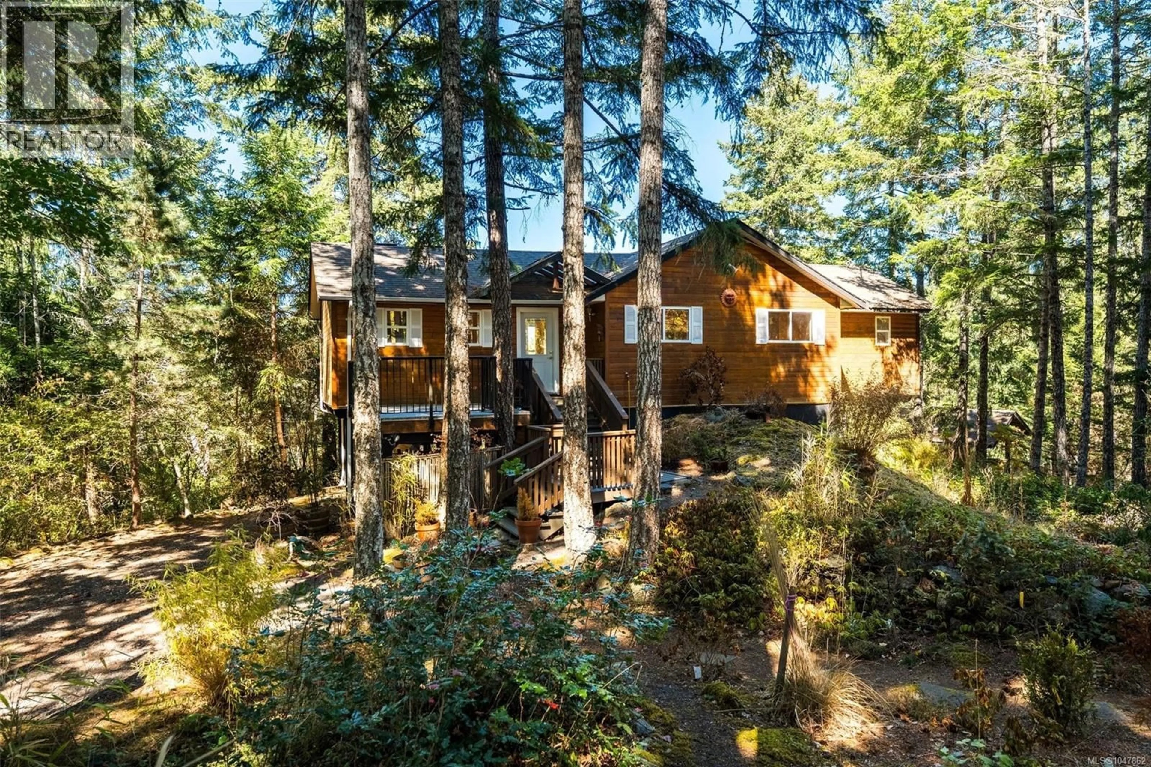A pic from outside/outdoor area/front of a property/back of a property/a pic from drone, forest/trees view for 1387 CLUN PLACE, Sooke British Columbia V9Z1B1
