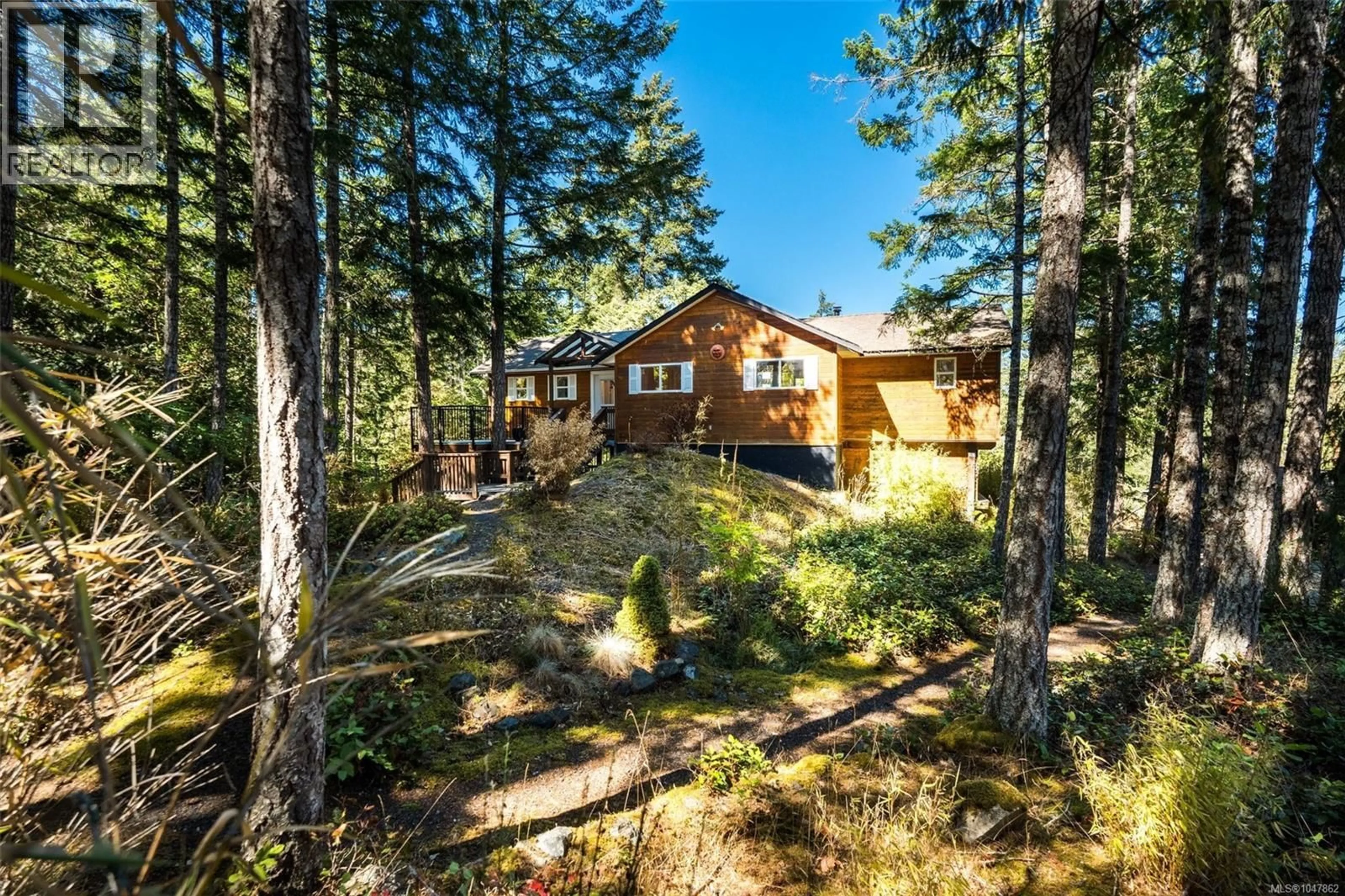 A pic from outside/outdoor area/front of a property/back of a property/a pic from drone, forest/trees view for 1387 CLUN PLACE, Sooke British Columbia V9Z1B1