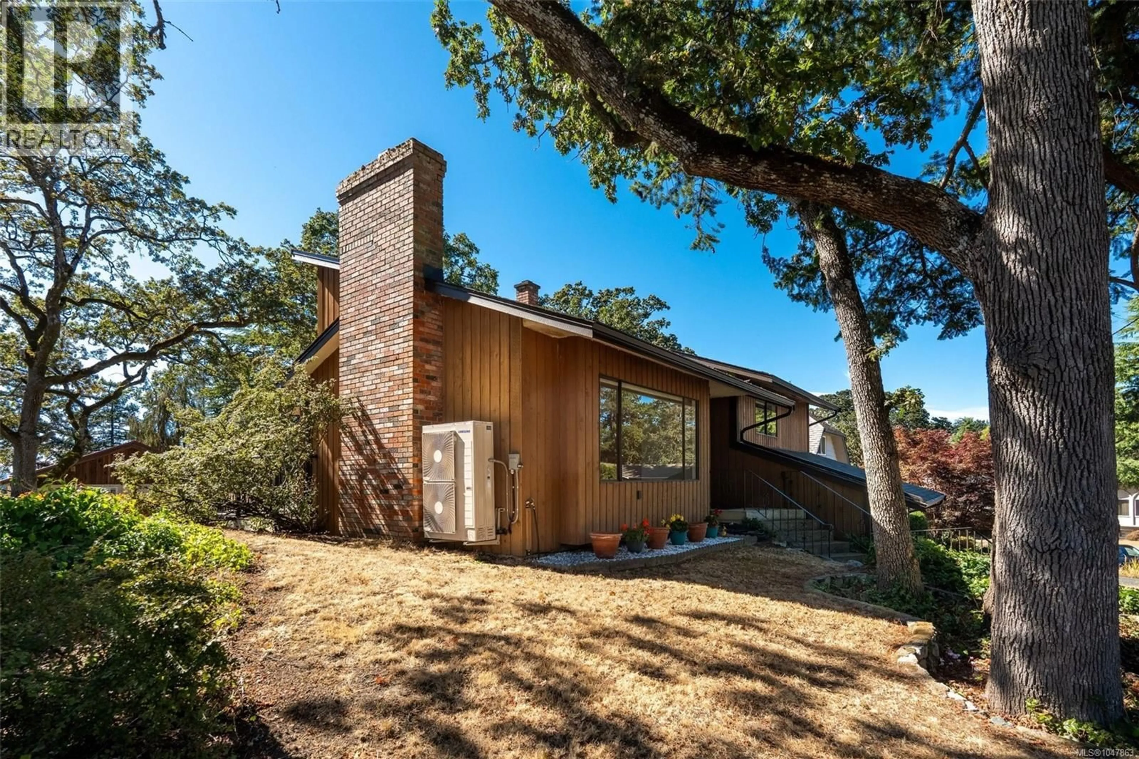 Home with brick exterior material, unknown for 973 LANDEEN PLACE, Saanich British Columbia V8X3Z4