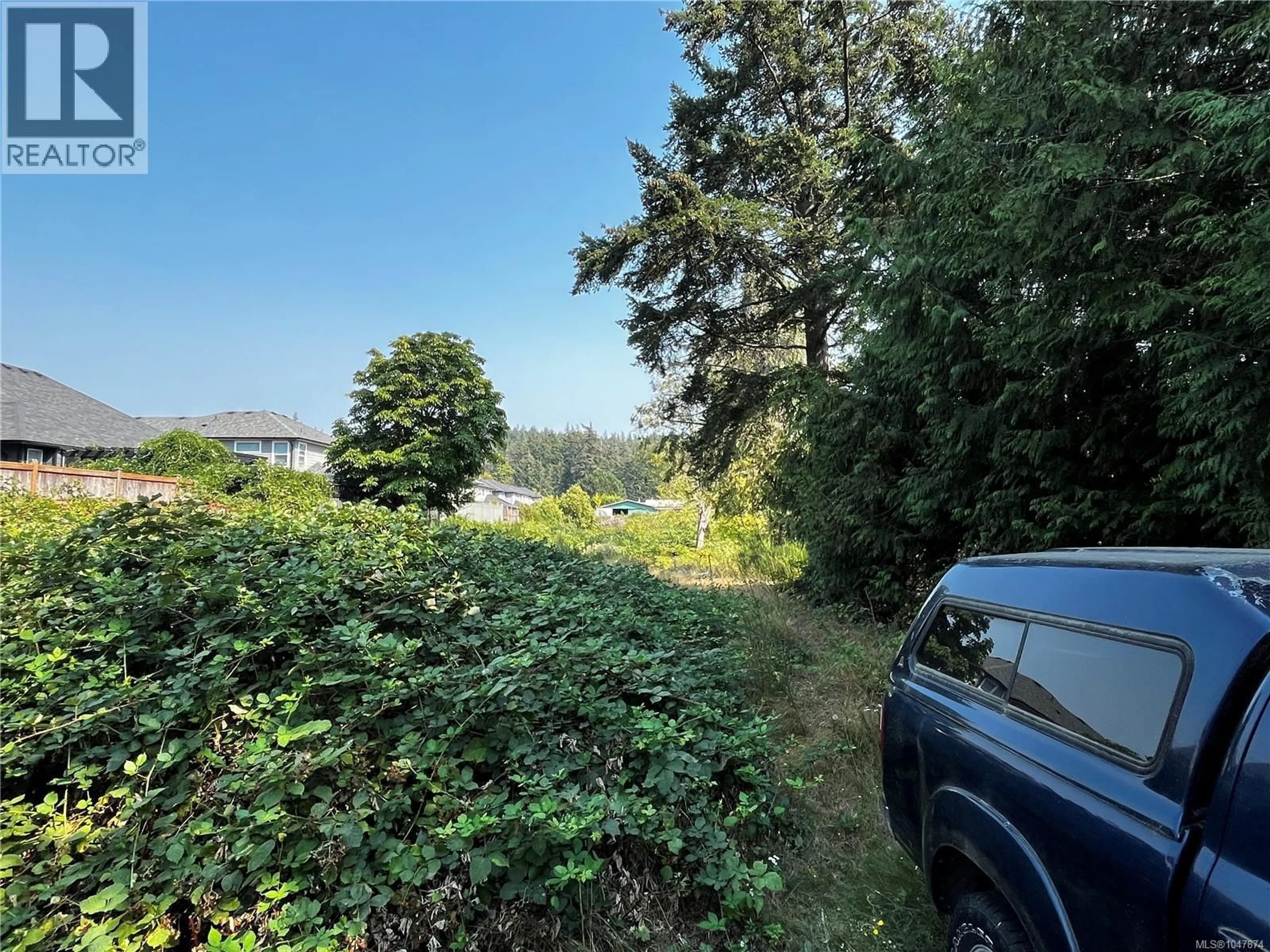 A pic from outside/outdoor area/front of a property/back of a property/a pic from drone, forest/trees view for 3409 LUXTON ROAD, Langford British Columbia V9Z2Z3