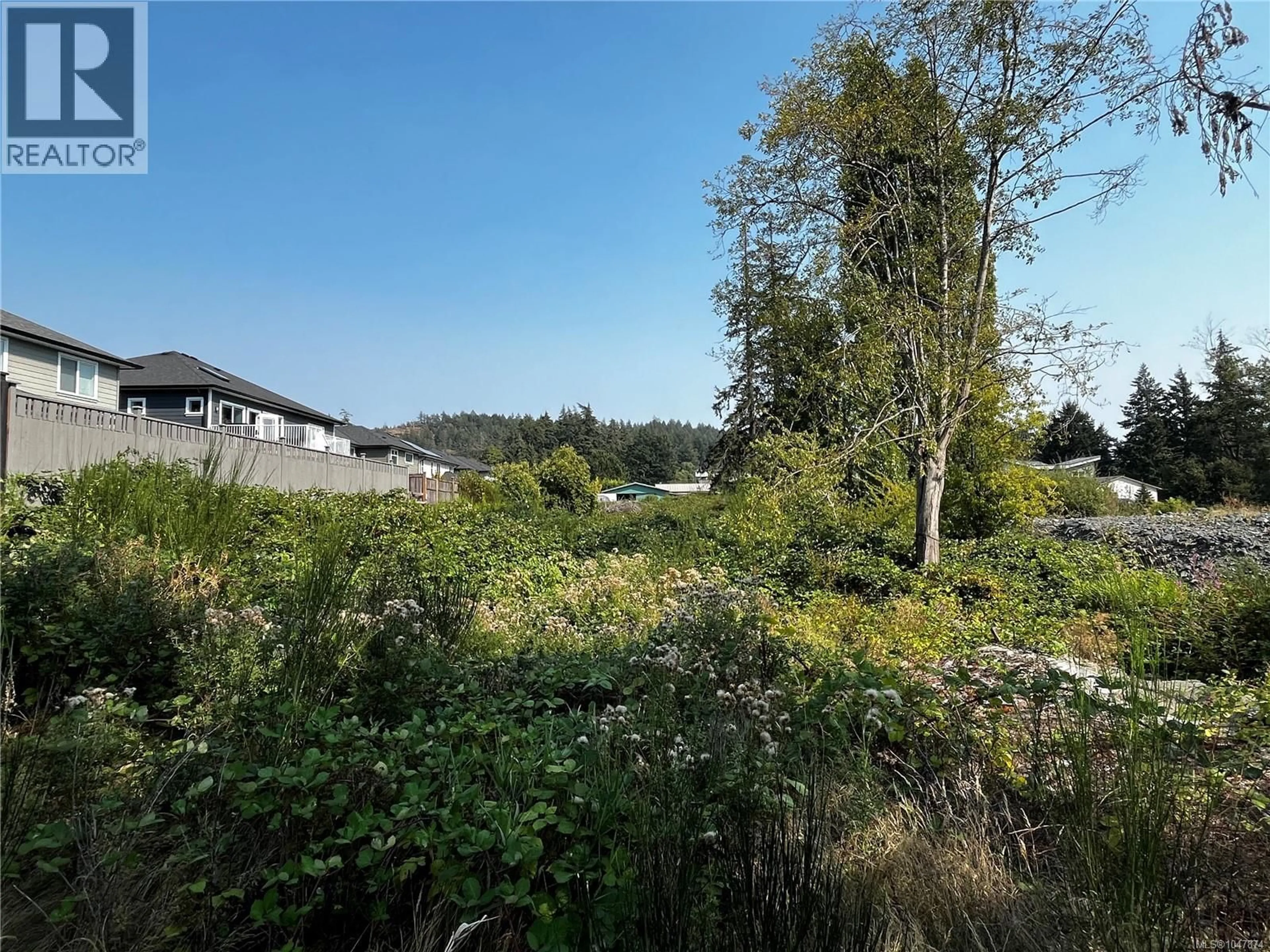 A pic from outside/outdoor area/front of a property/back of a property/a pic from drone, forest/trees view for 3409 LUXTON ROAD, Langford British Columbia V9Z2Z3