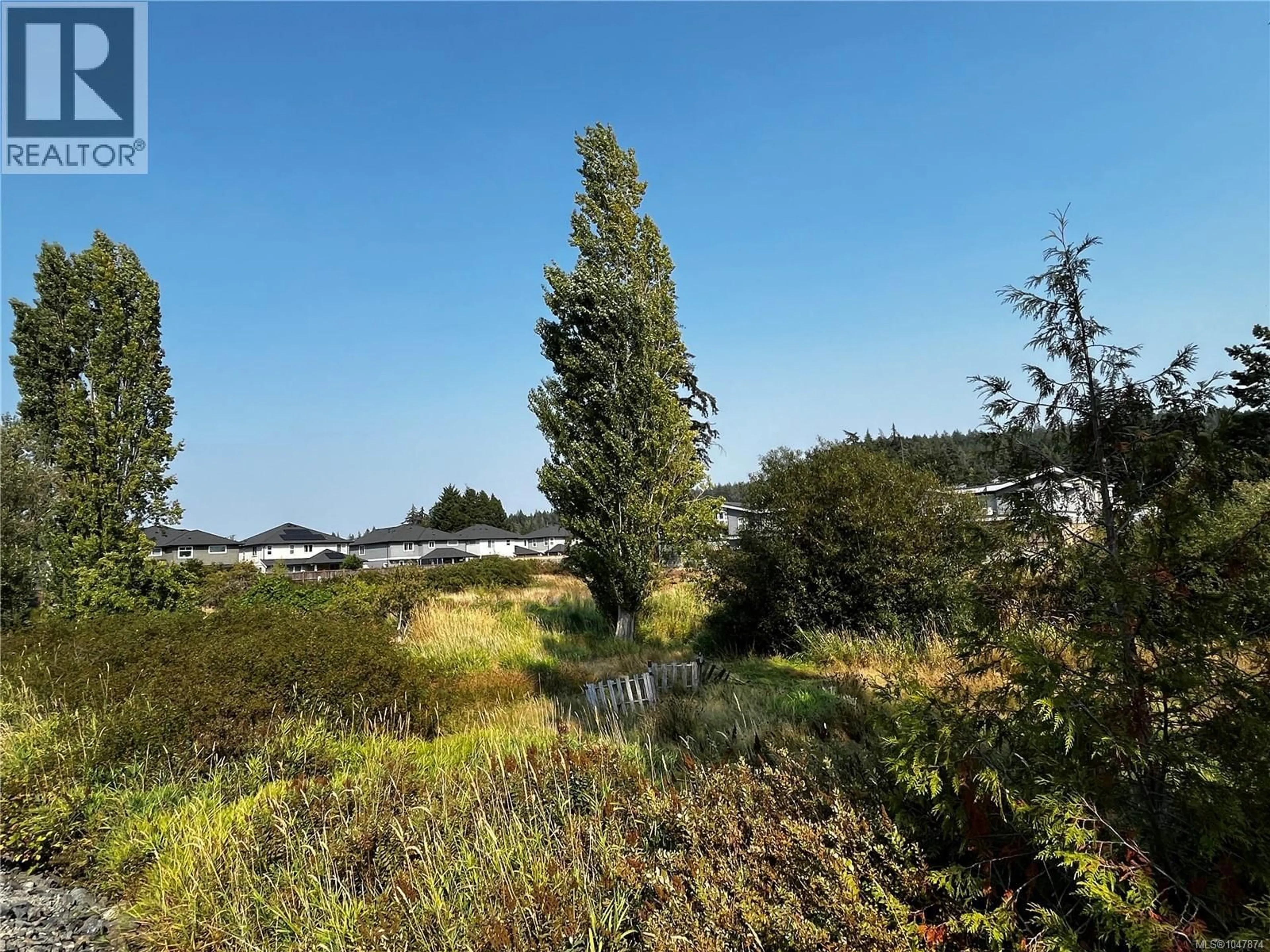 A pic from outside/outdoor area/front of a property/back of a property/a pic from drone, forest/trees view for 3409 LUXTON ROAD, Langford British Columbia V9Z2Z3