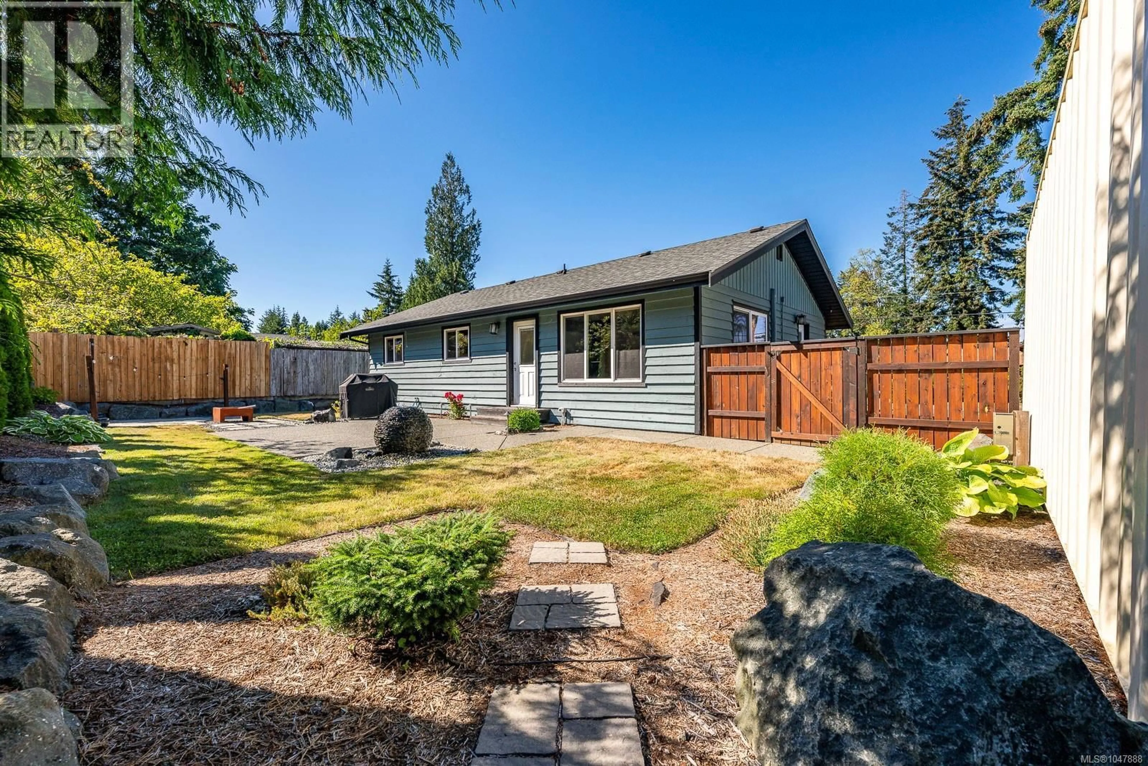 Home with vinyl exterior material, street for 1577 BAILLIE ROAD, Comox British Columbia V9M4C6